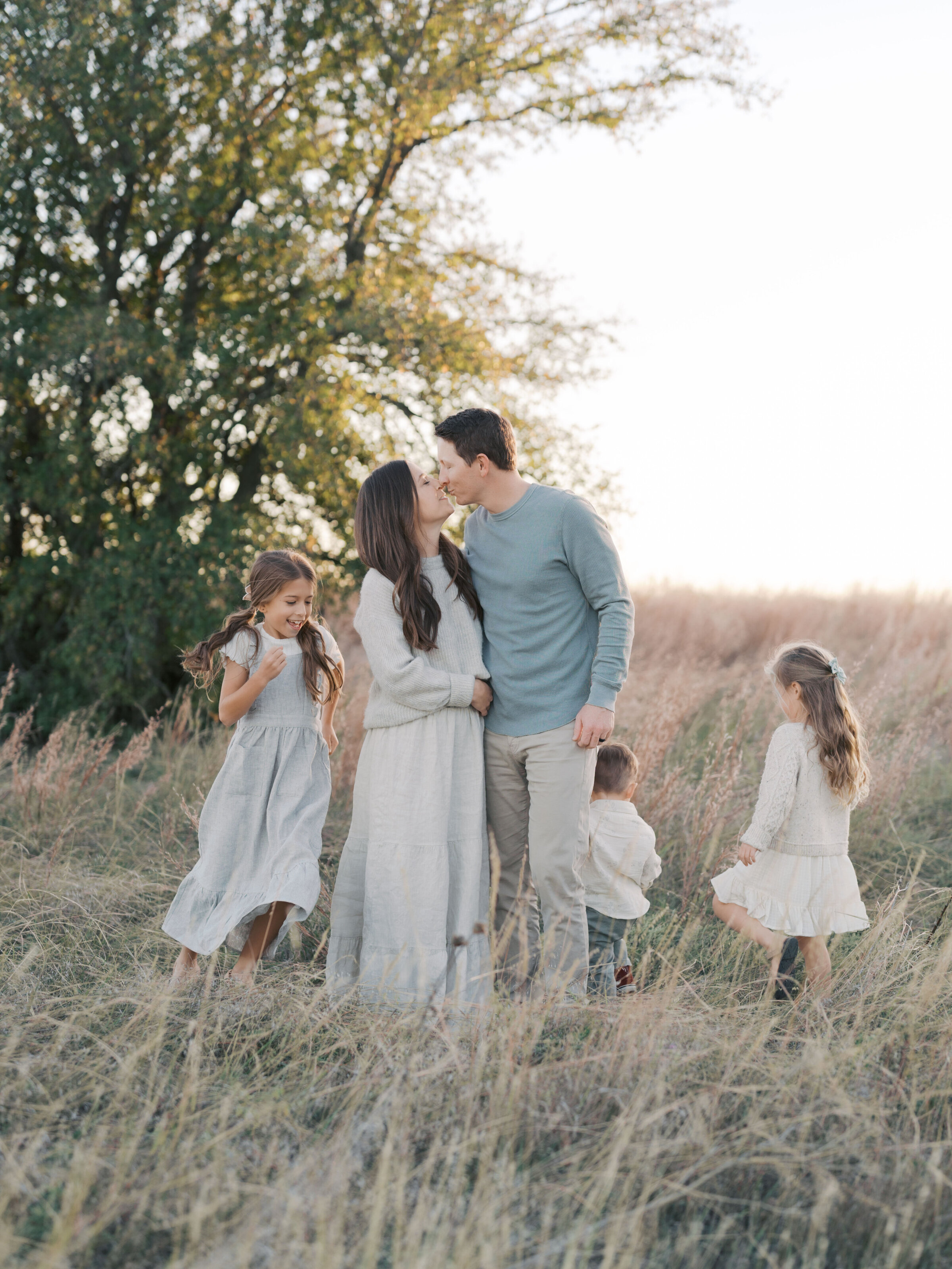 Family Playing in field by Colorado Springs Family Photographer | Lauren Bounds