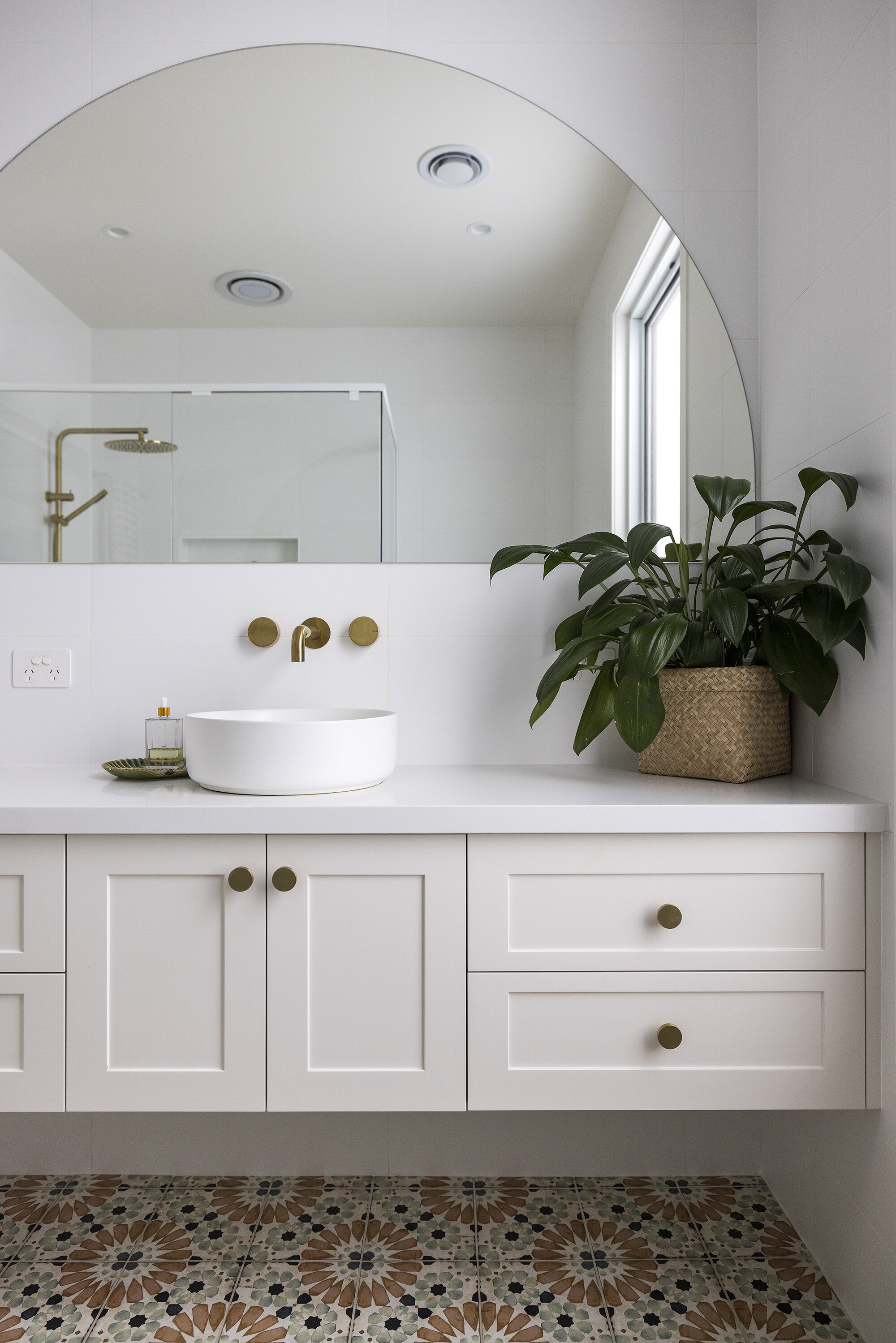 Bathroom design mosaic tile brass tapware white vanity