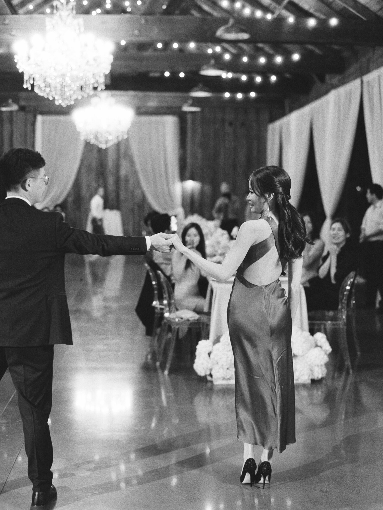black and white film image of bride and grooms first dance