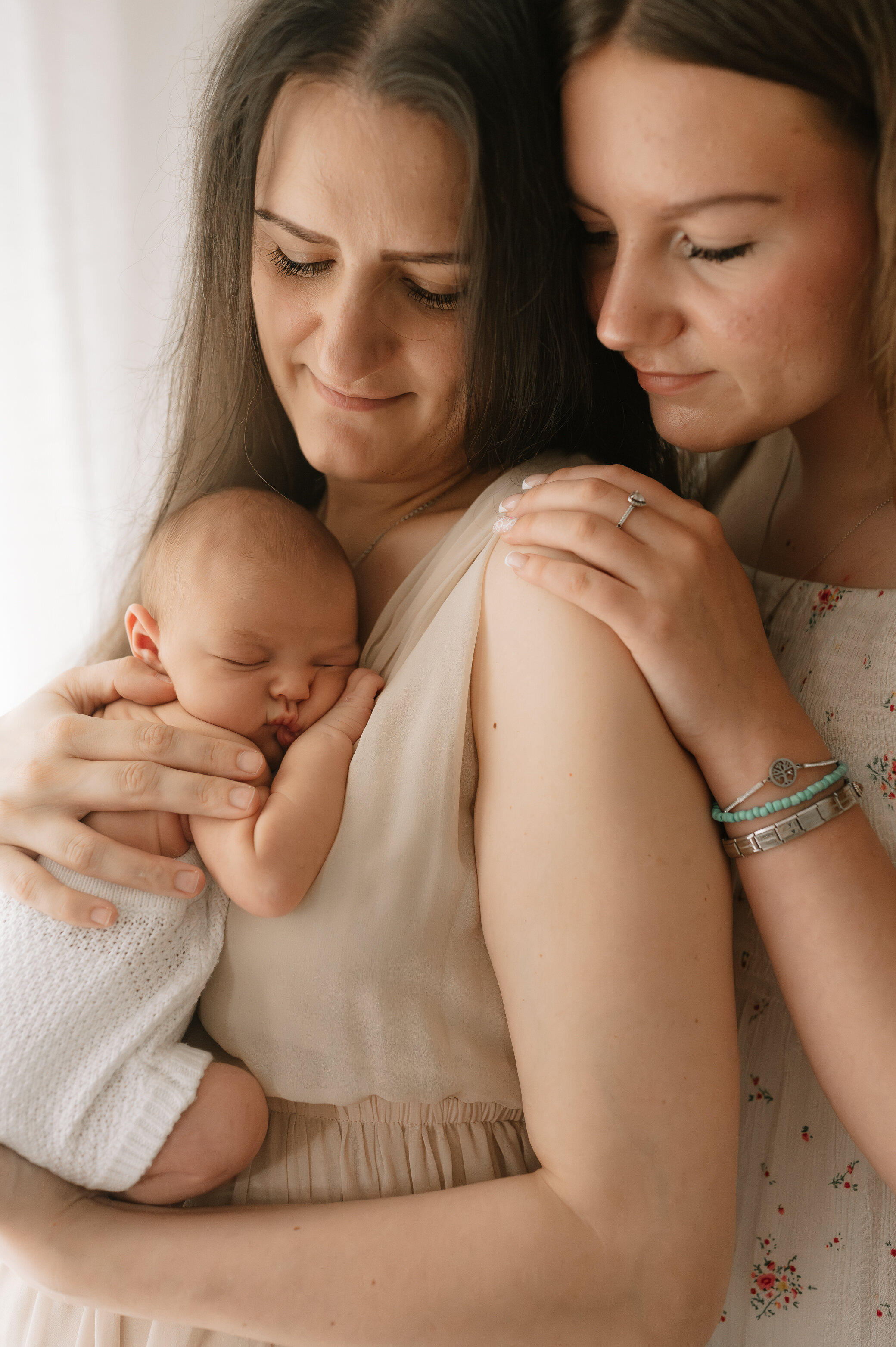 newborn baby girl her mum and big sister at york studio
