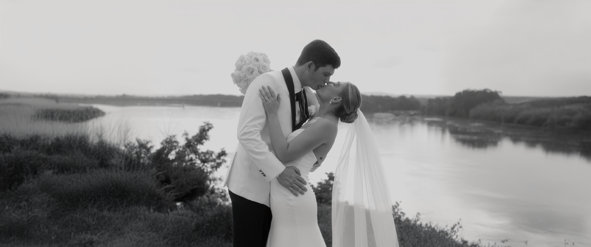 Video thumbnail showcasing Tessa and Garrett Vance’s wedding at Hermann Hill Weddings in Hermann, Missouri, featuring Tessa walking down the aisle with her dad, Garrett in tears, and a joyful reception with dancing, laughter, and heartfelt toasts.