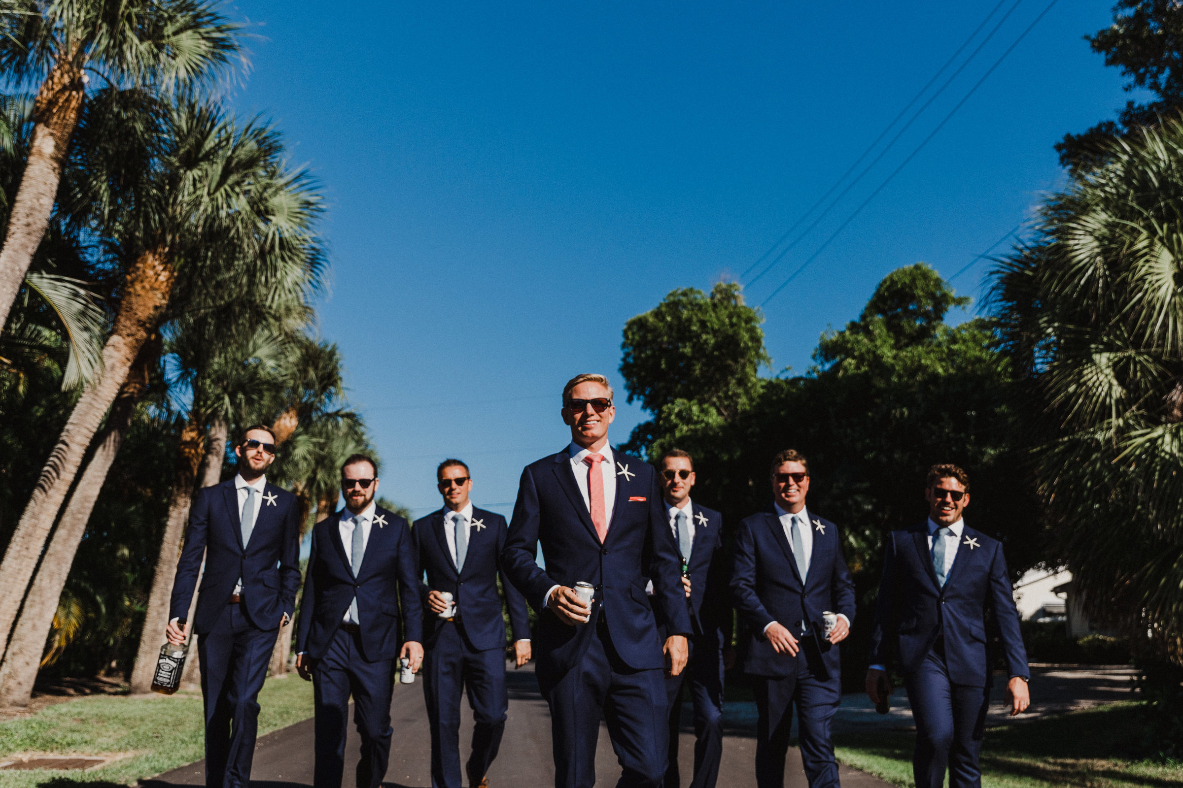 gasparilla inn and club wedding groomsmen walk to ceremony
