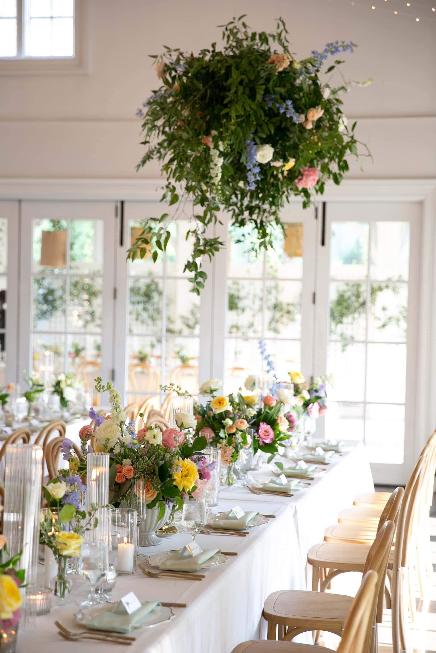 spring wedding floral arrangements at the Carriage House of Merrimon-Wynne. Merrimon-Wynne reception decor by Raleigh wedding photographer