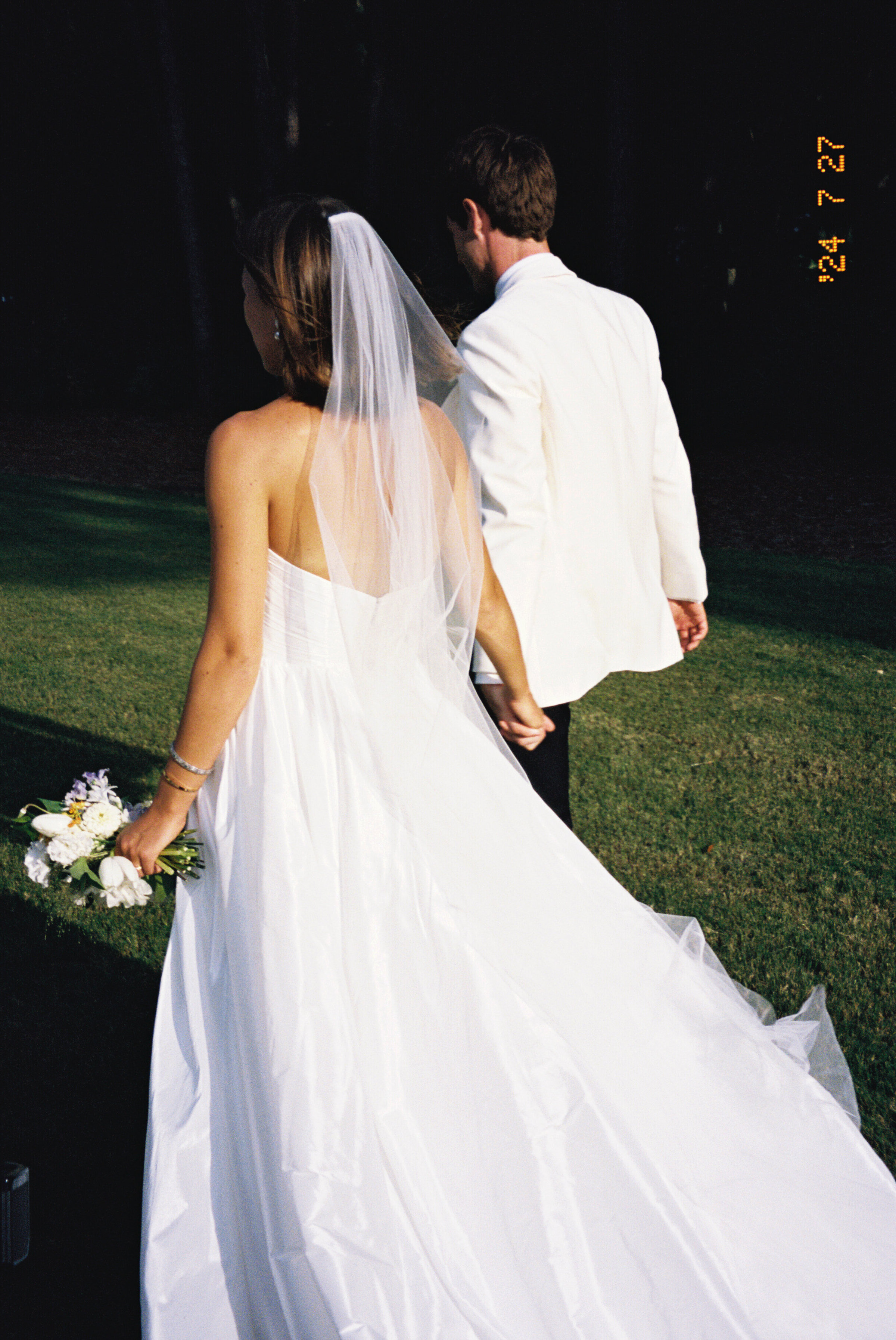 a bride in groom walking after their ceremony in St. Simons Island, GA