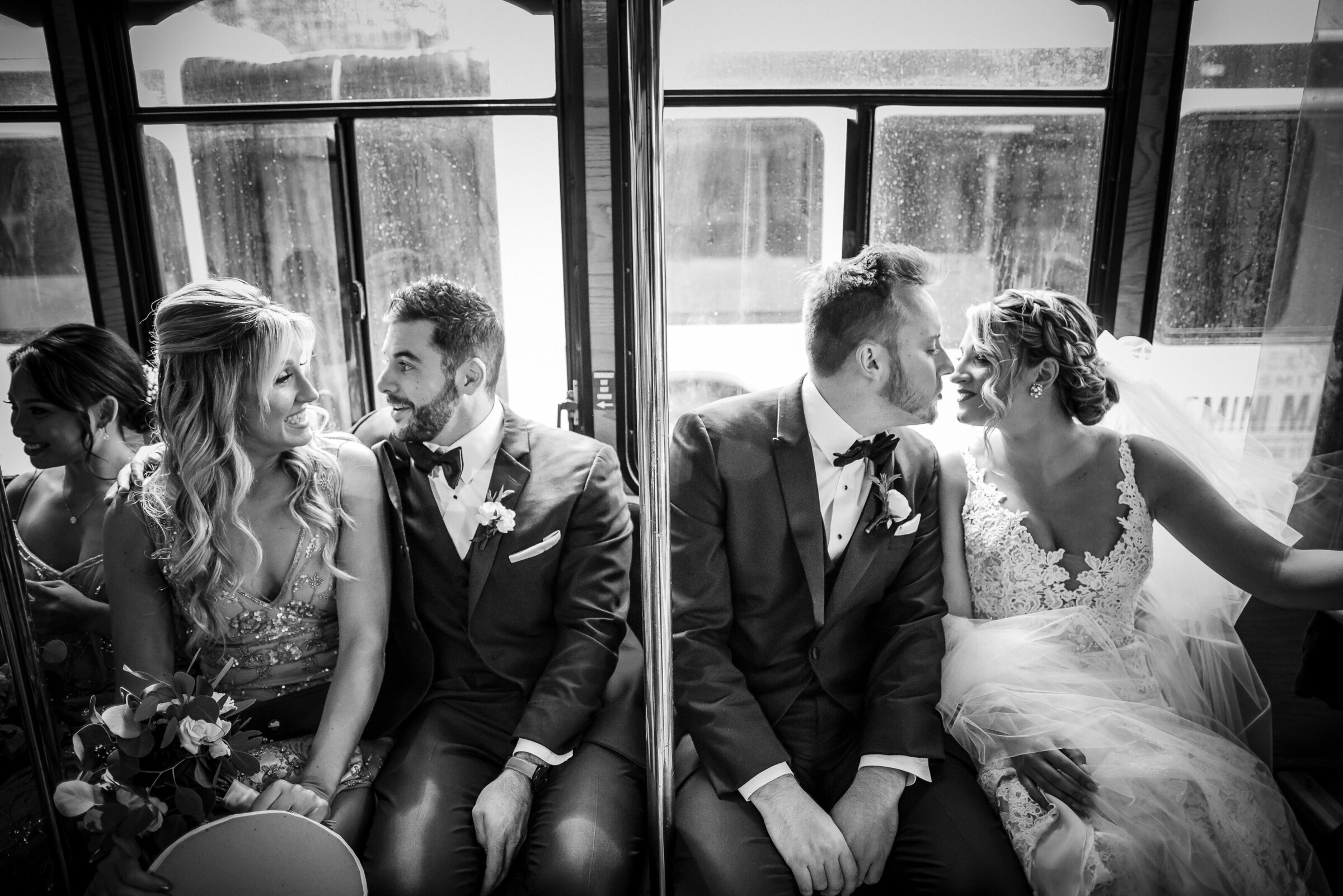 Bridal Party candid moment during a ride on a Cescaphe Trolley in Philadelphia