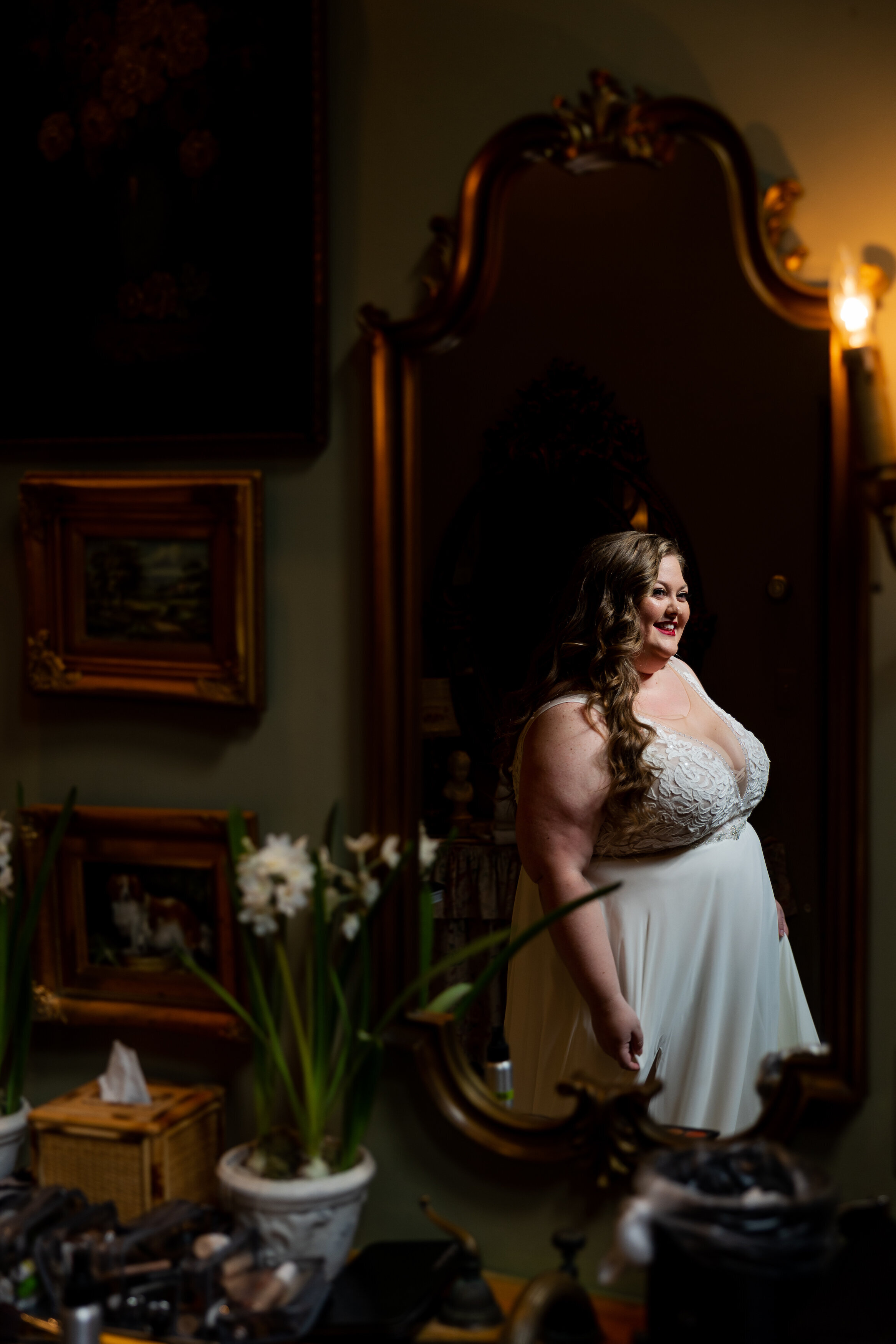 Bride reflecting in mirror on her wedding day