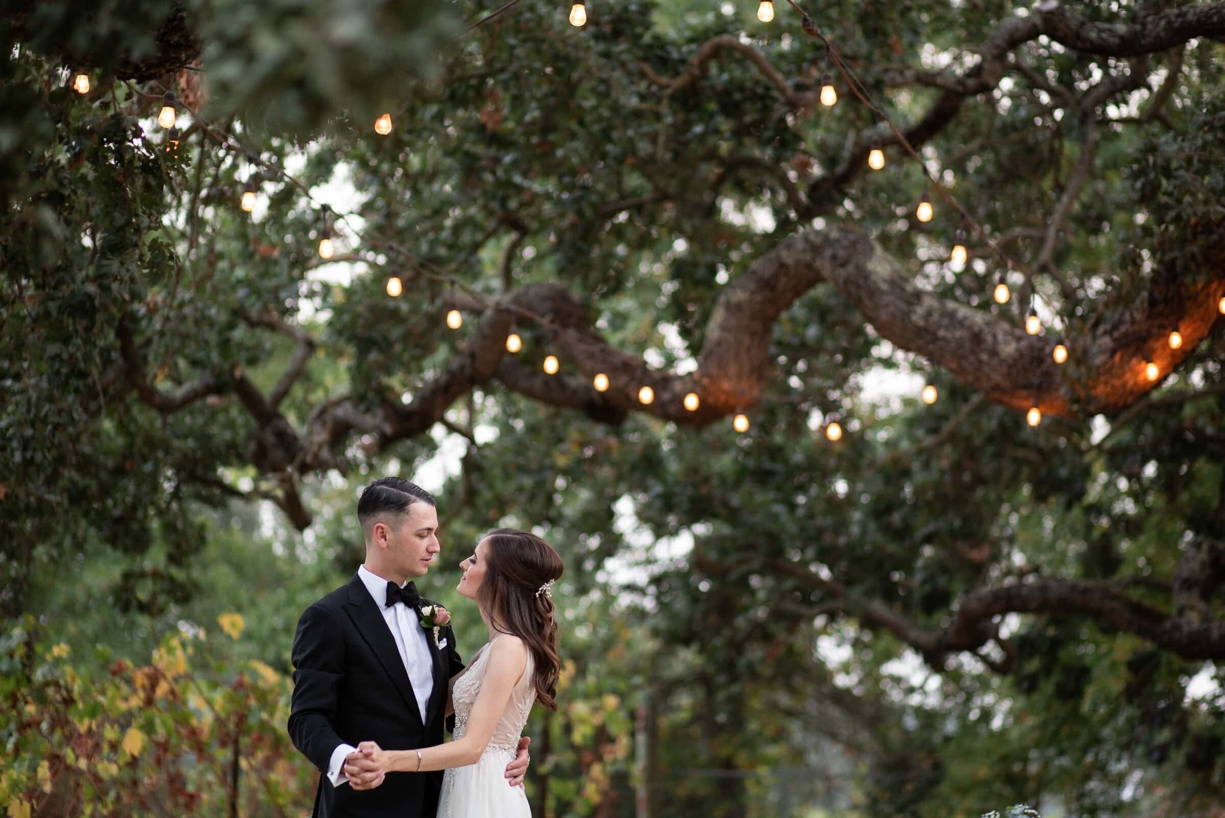 First dance under an oak tree. Elopement wedding photographer in North Carolina.