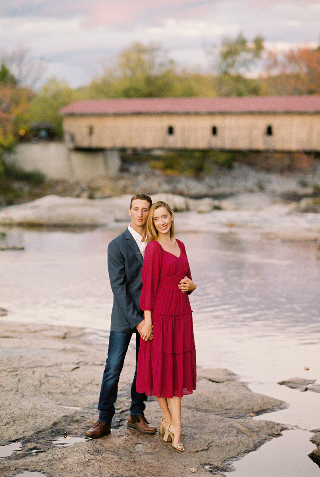 adirondack engagement photos at sunset near a stream photographed on film