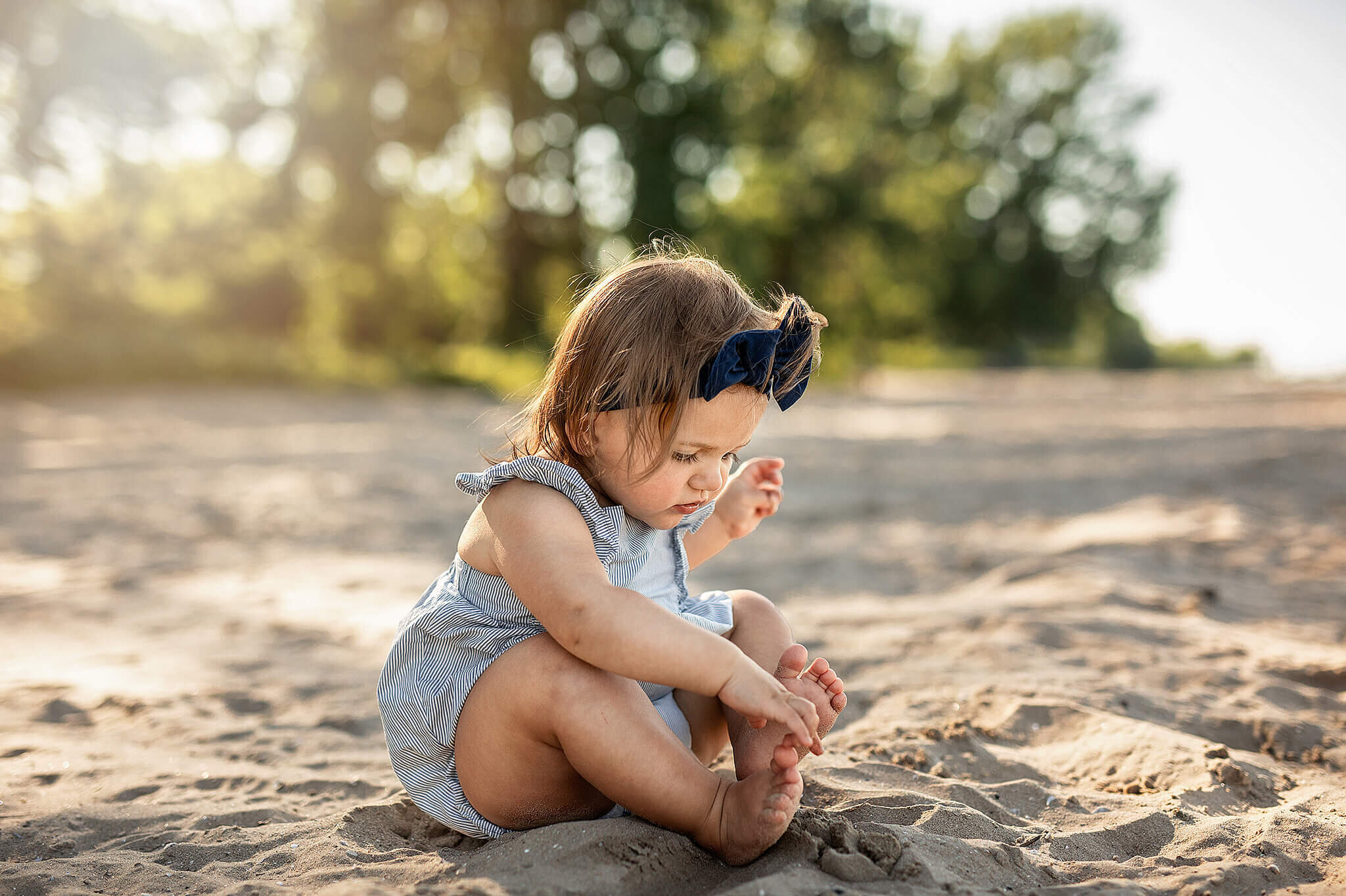 9 month old girl sitting down at east harbor state park