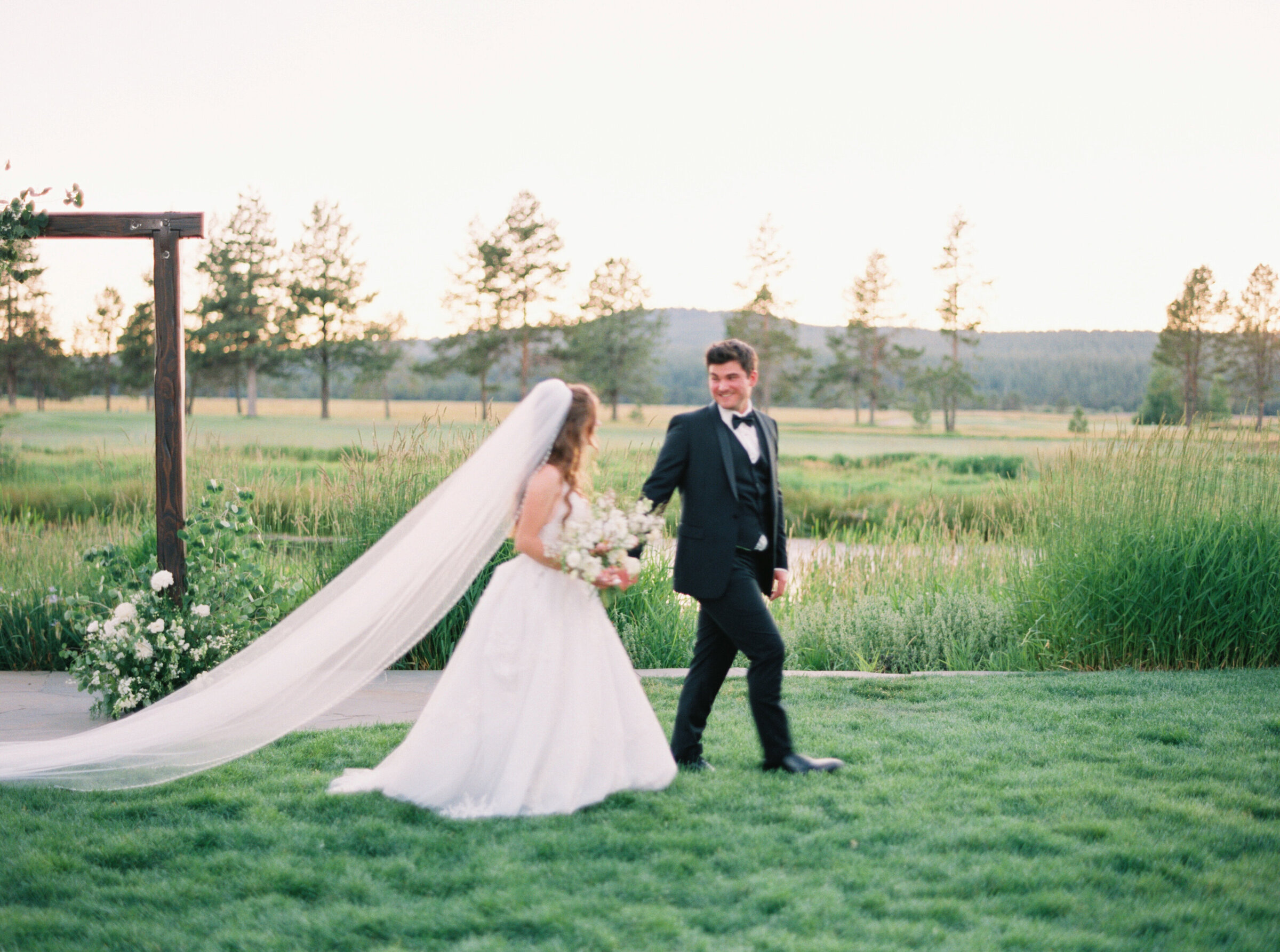 Couple walking  into their wedding reception in Bend, Oregon