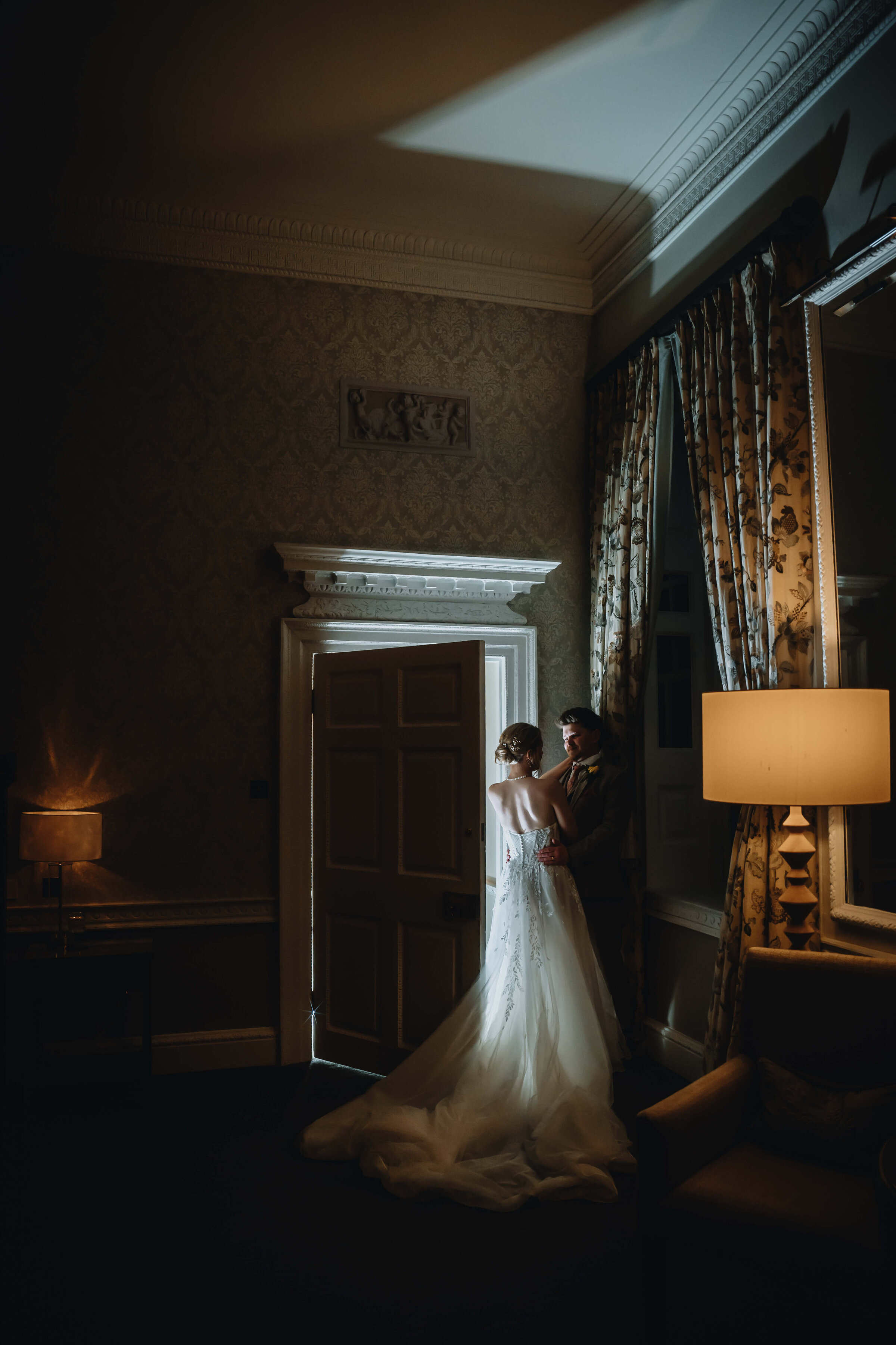 buxted-park-wedding-couple-in-bedroom-night