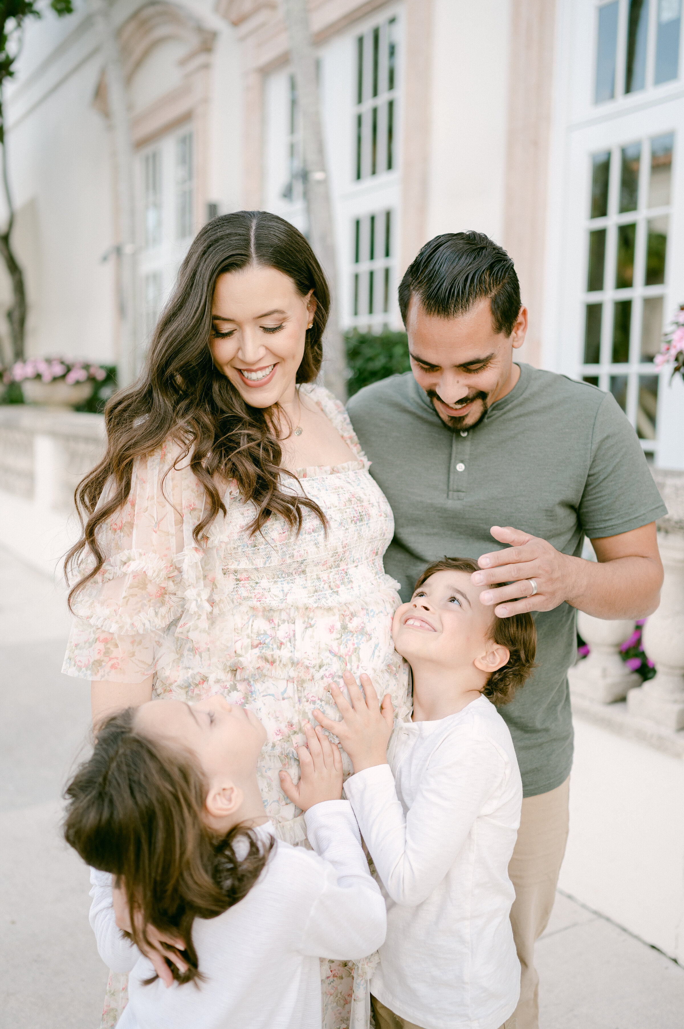 Kids hugging pregnant mom by Miami Family Photographer