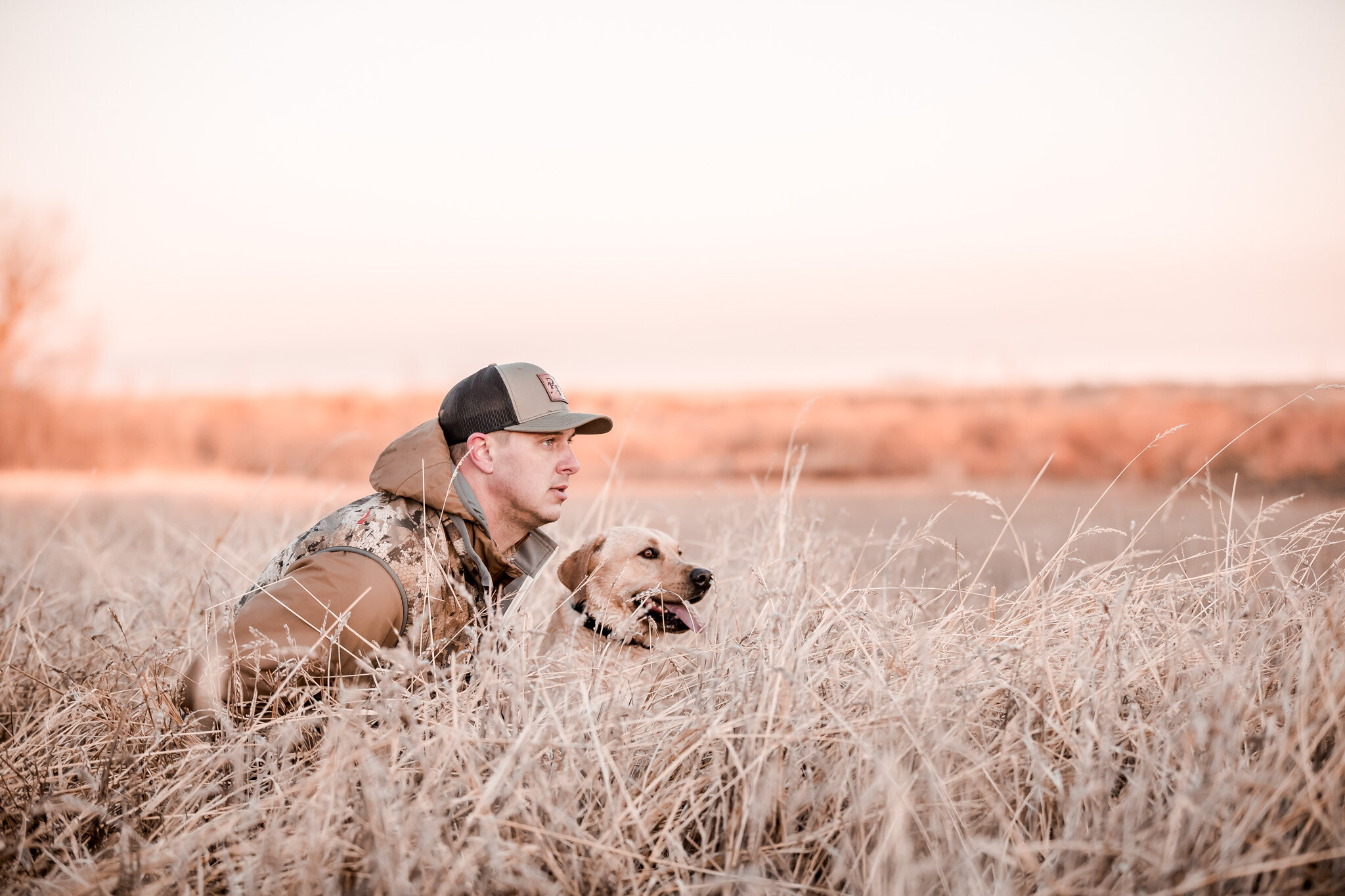 Waterfowl hunter with his hunting dog