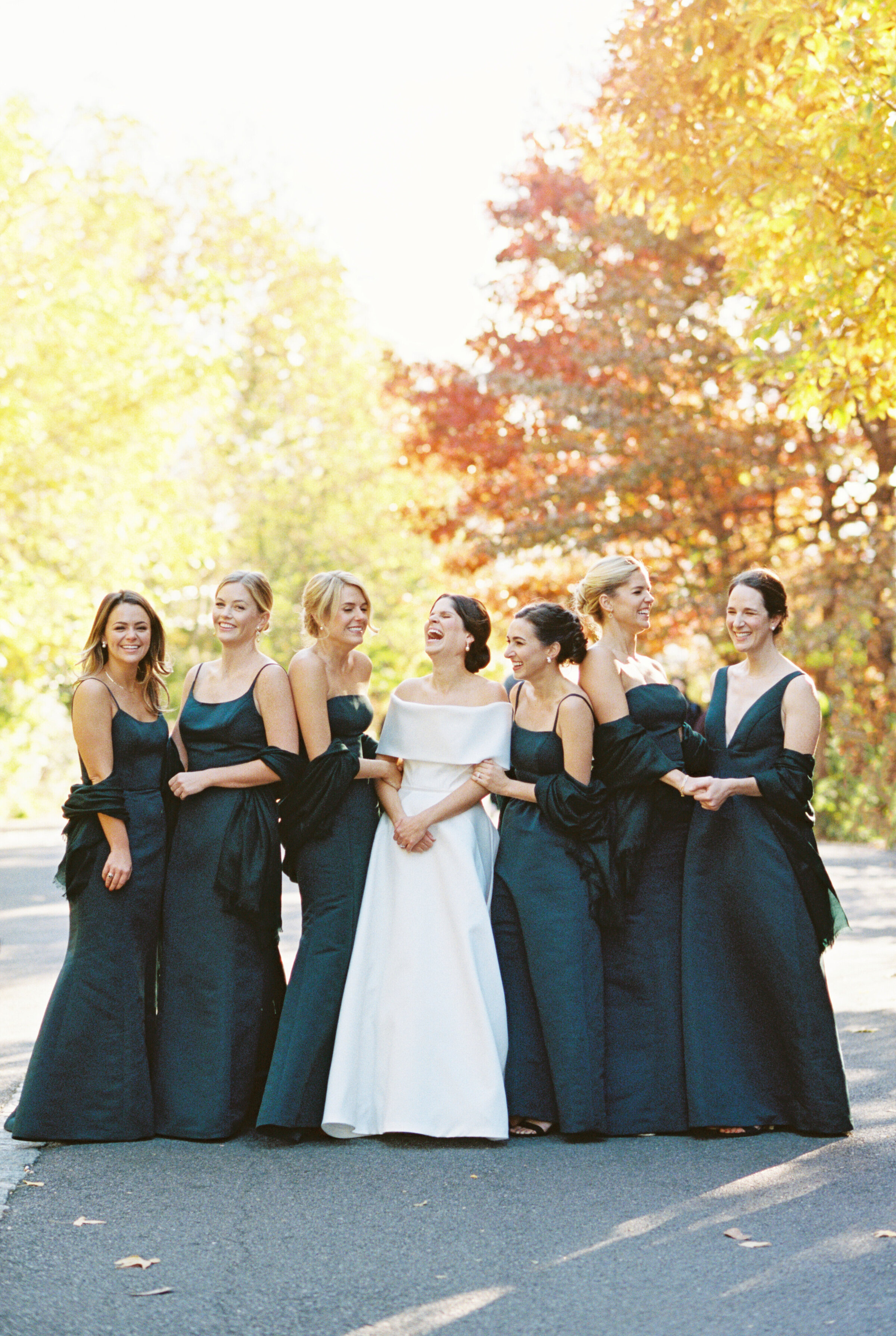 bride and bridesmaids laugh together at Brooklyn Heights wedding