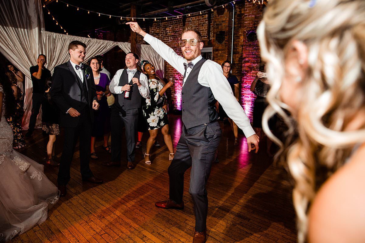 Wedding guest dancing during reception