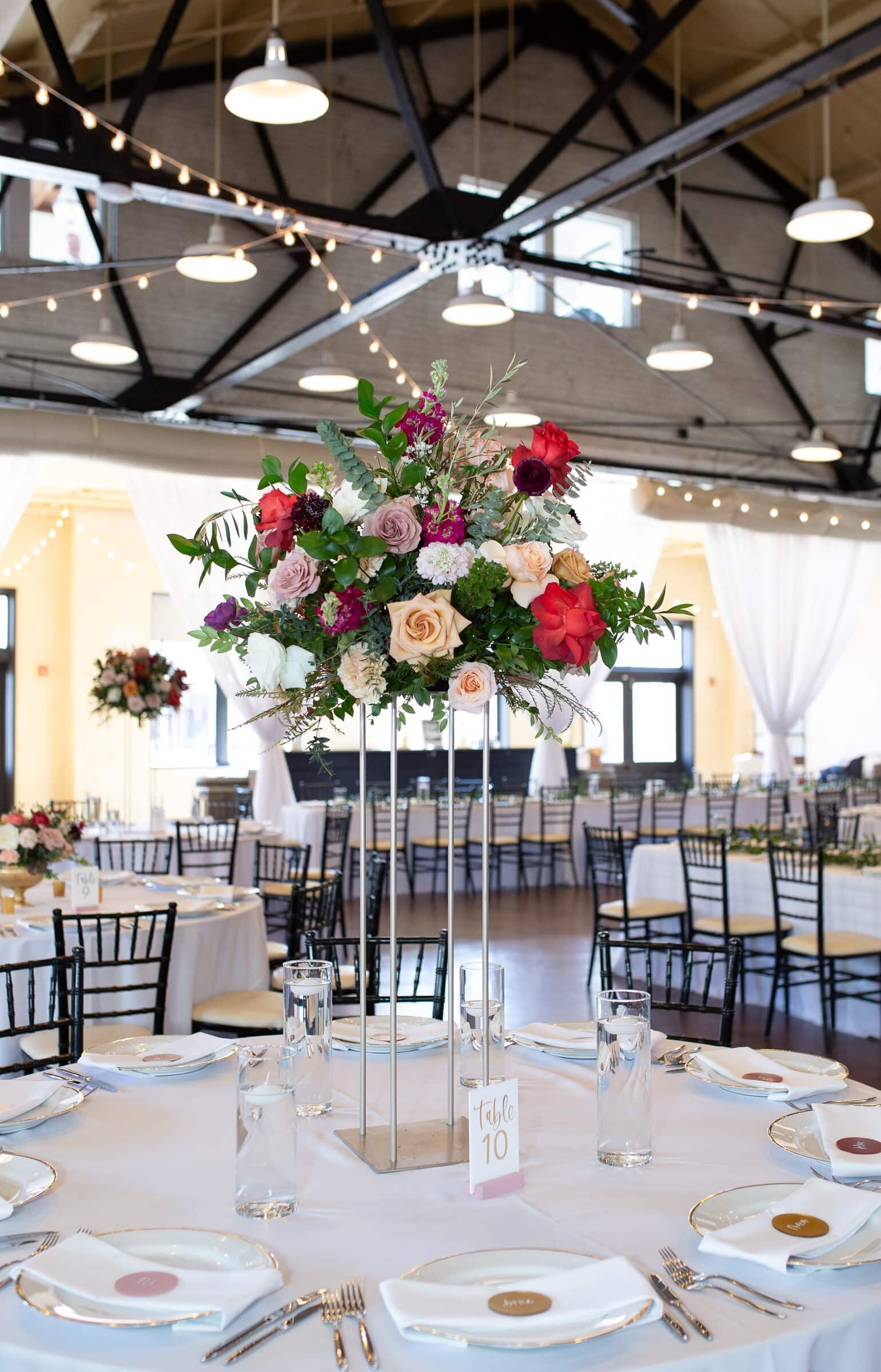 Market Hall wedding reception tall floral setup. Winter wedding at Market Hall Raleigh,