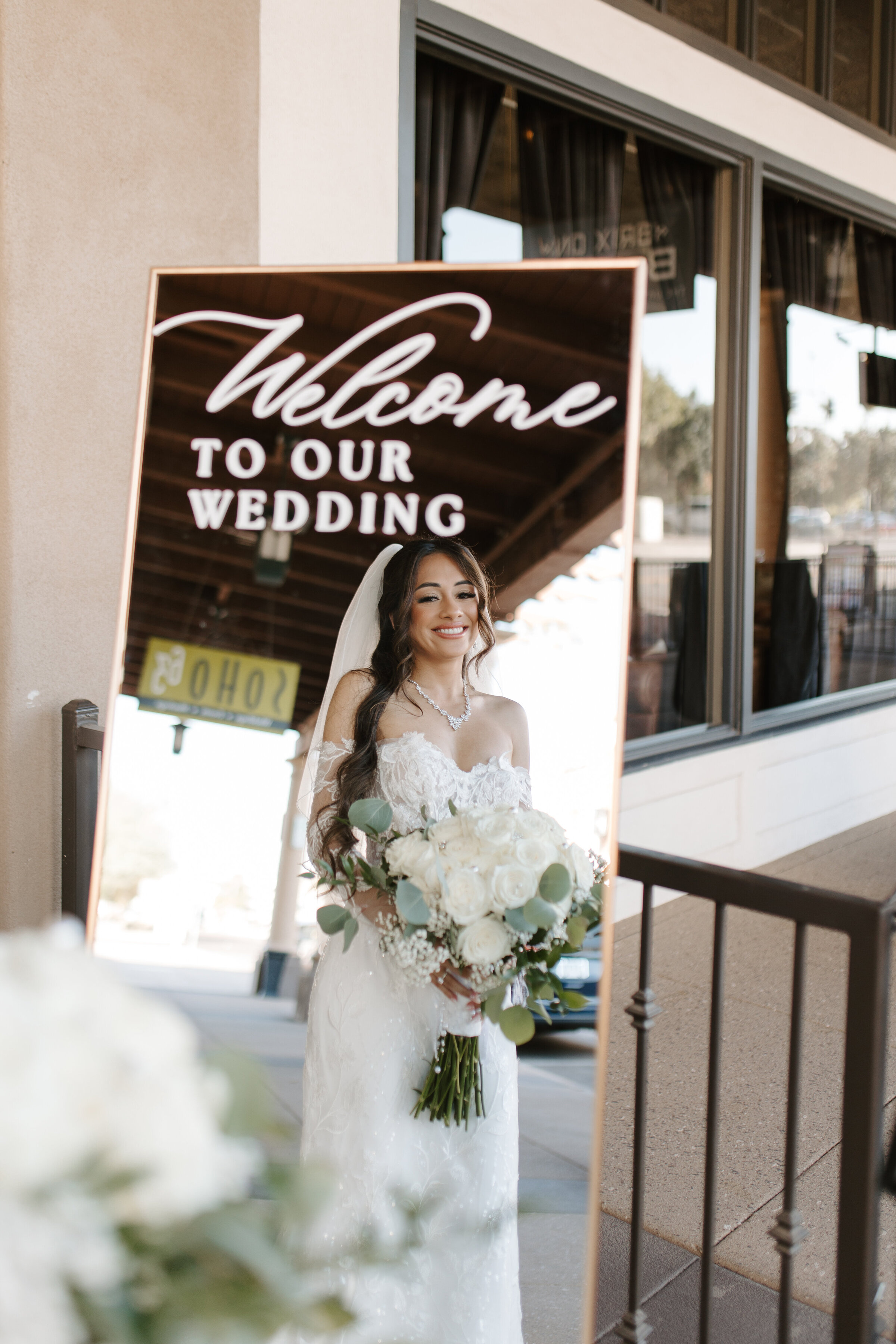 soho63-phoenix-wedding-venue-bride-and-the-welcome-sign-downtown