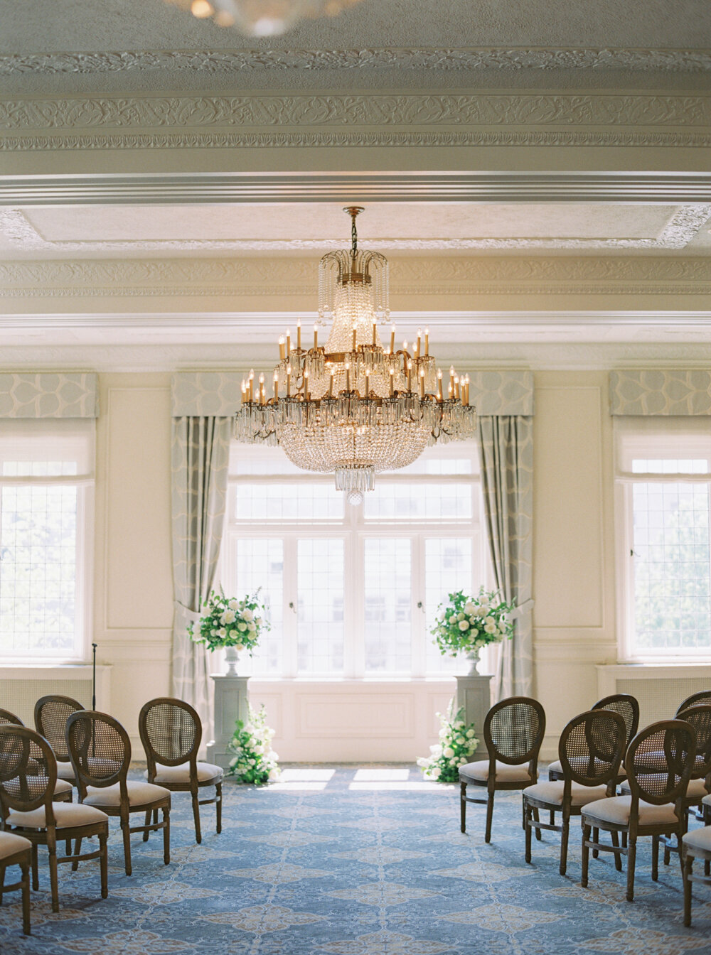 historic seattle wedding venue the rainier club ceremony in the heritage room with wooden chairs
