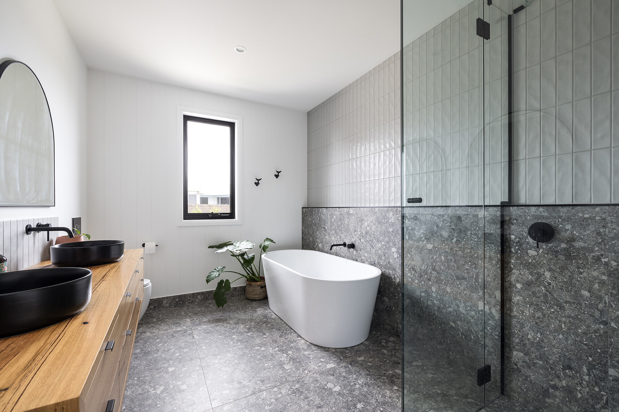 Modern bathroom design dark tile black basin timber vanity