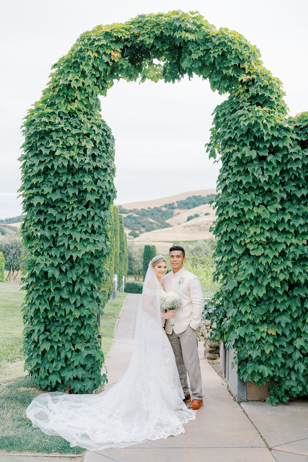 viansa winery wedding with couple under arch