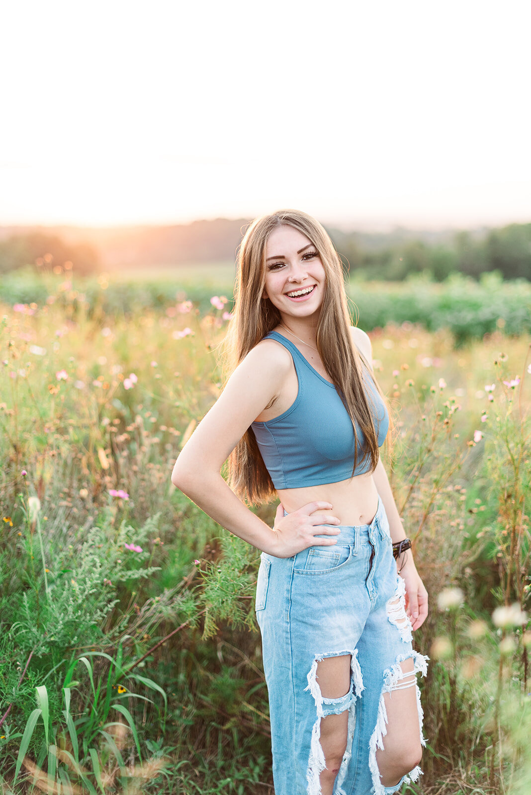 senior session wildflower lookout lancaster pa with sun set in the background