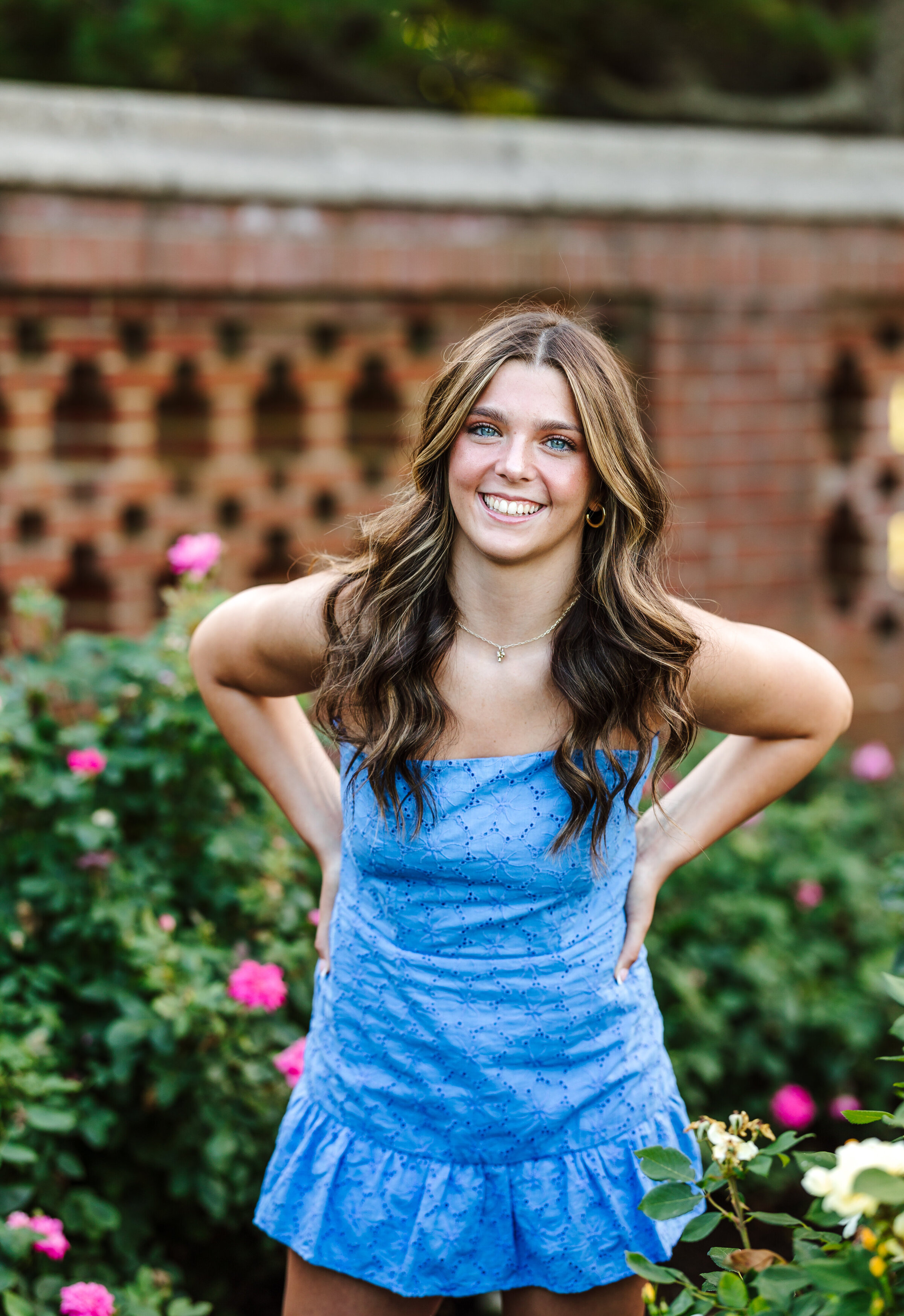 Senior girl photo in garden wearing blue dress in Beverly, Massachusetts