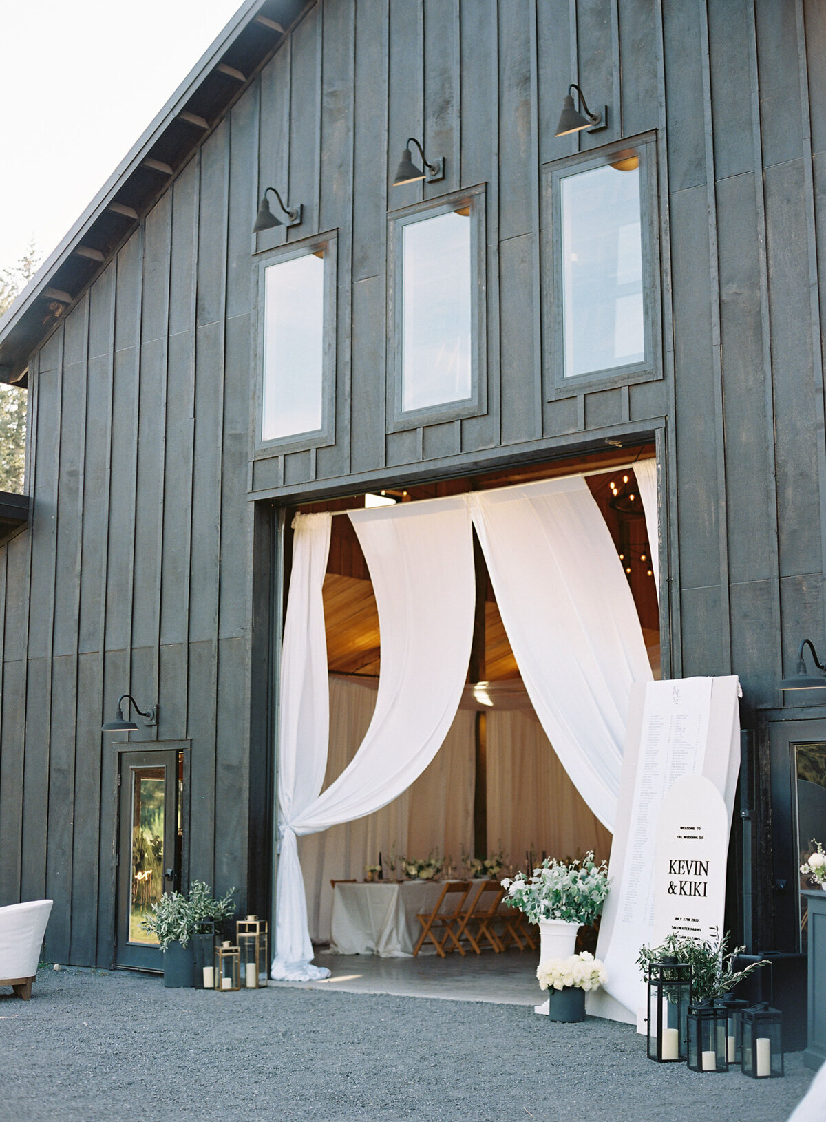 black modern wedding venue barn with white draping