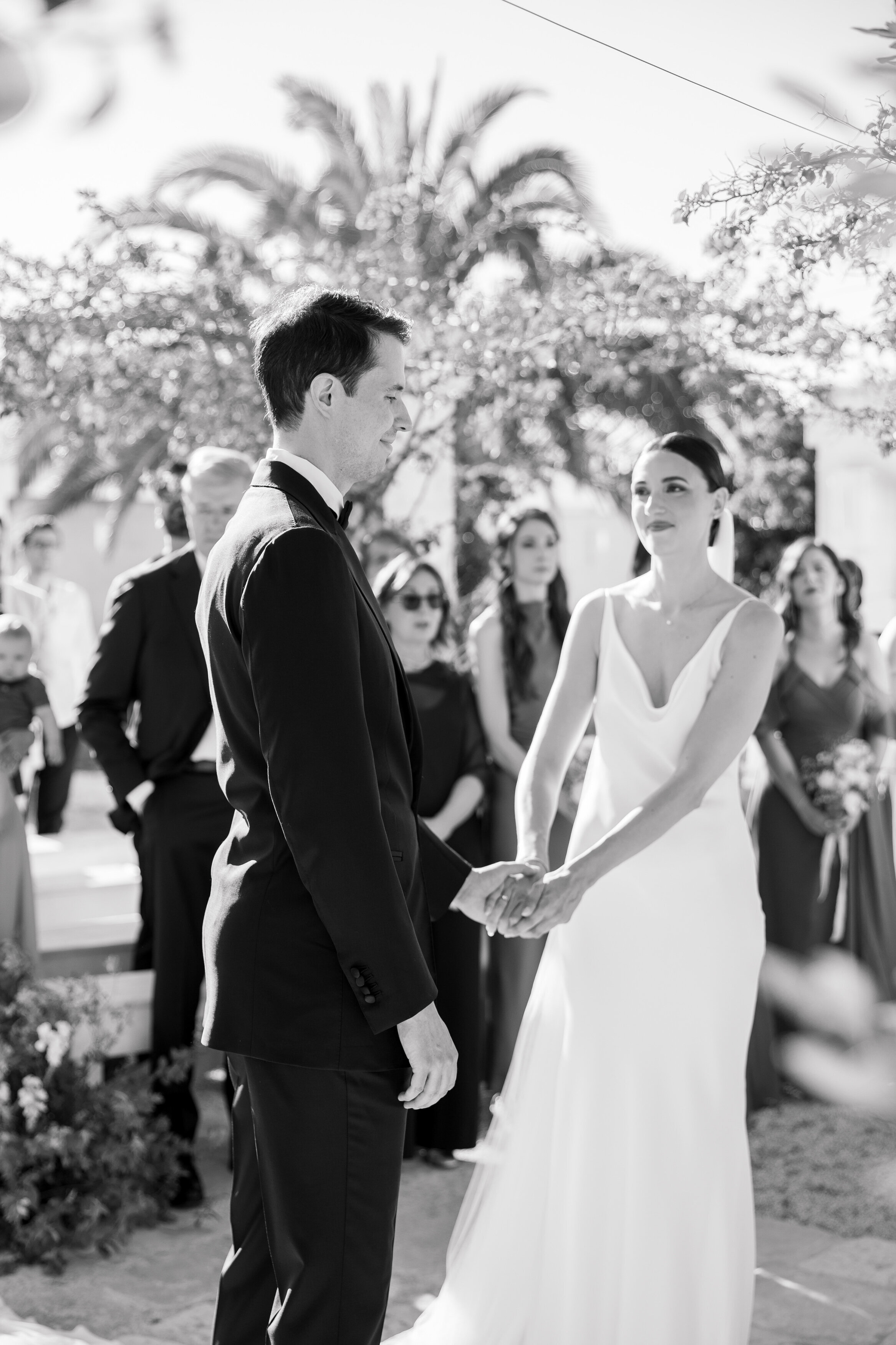 Wedding and Elopement Photographer, black and white image of bridal couple holding hands