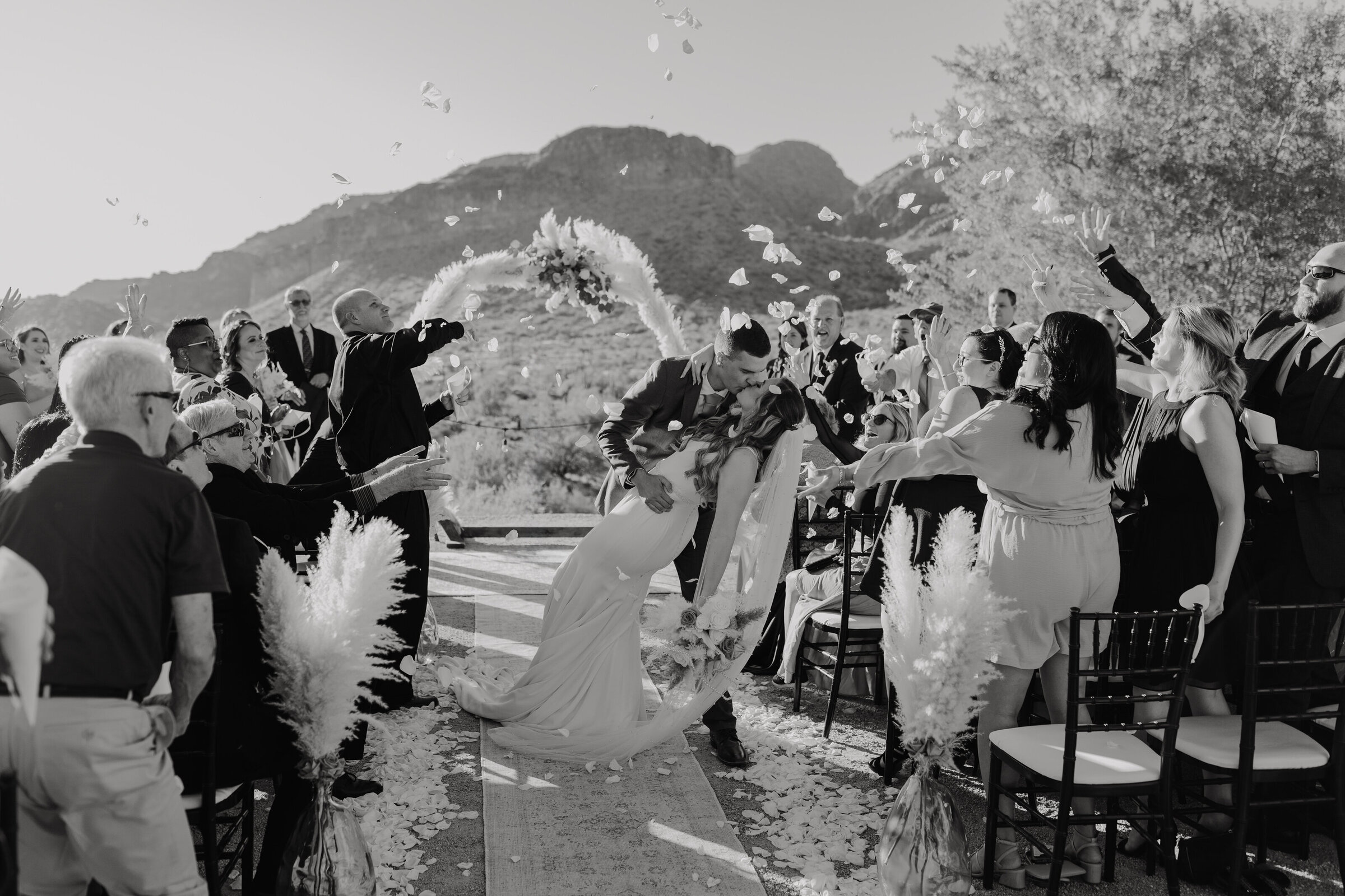 A couples walks back down the aisle after getting married in San Tan Valley, Arizona