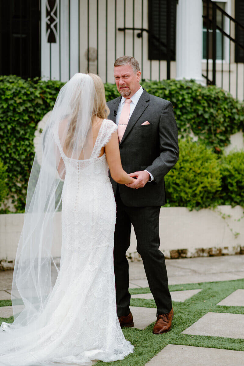 bride and groom smiling and holding hands taken by lexington kentucky wedding photographers