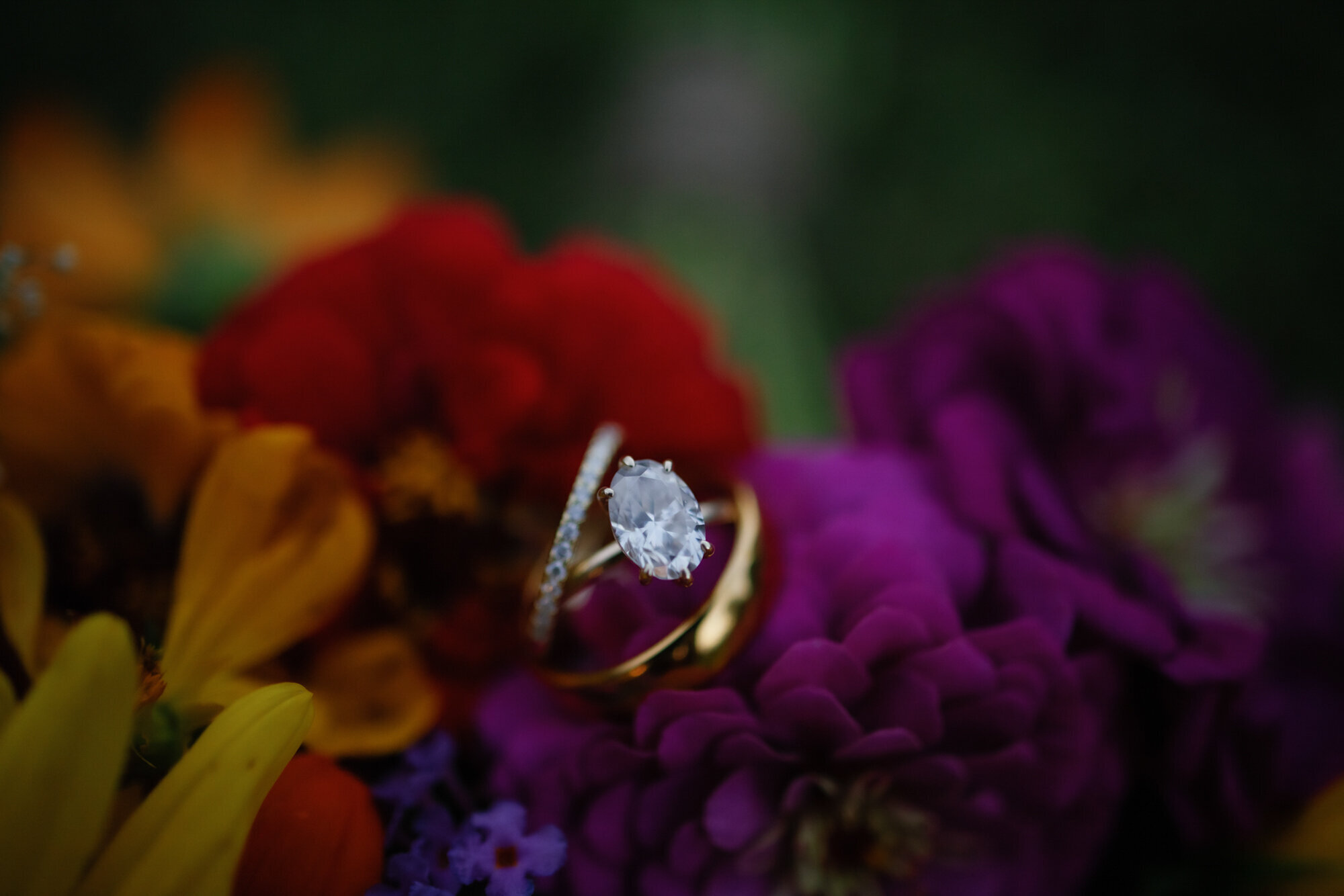 detail shot of engagement ring sitting on a floral bouquet for Gatlinburg elopement