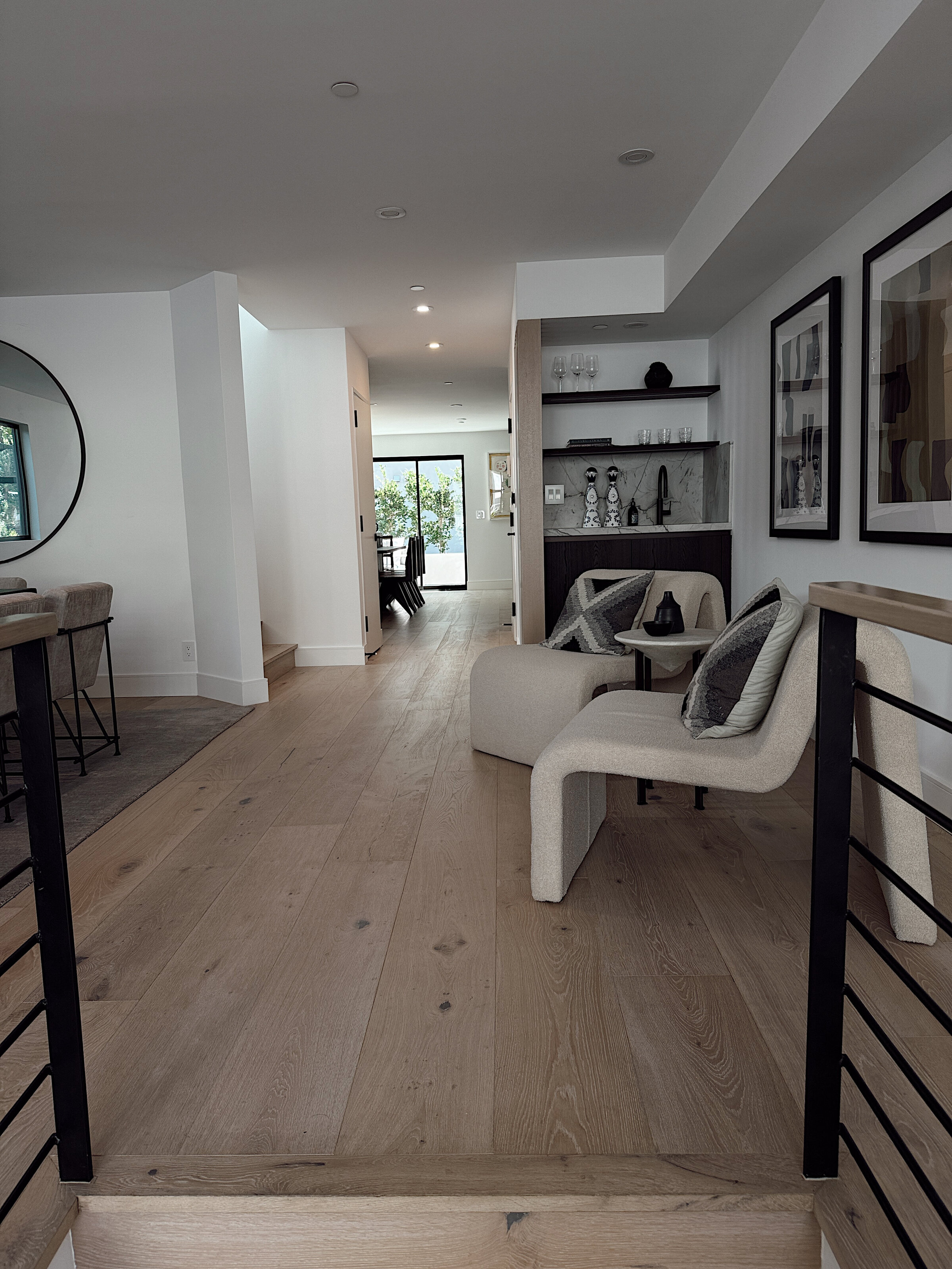 Furnished contemporary living space with wide-plank hardwood floors