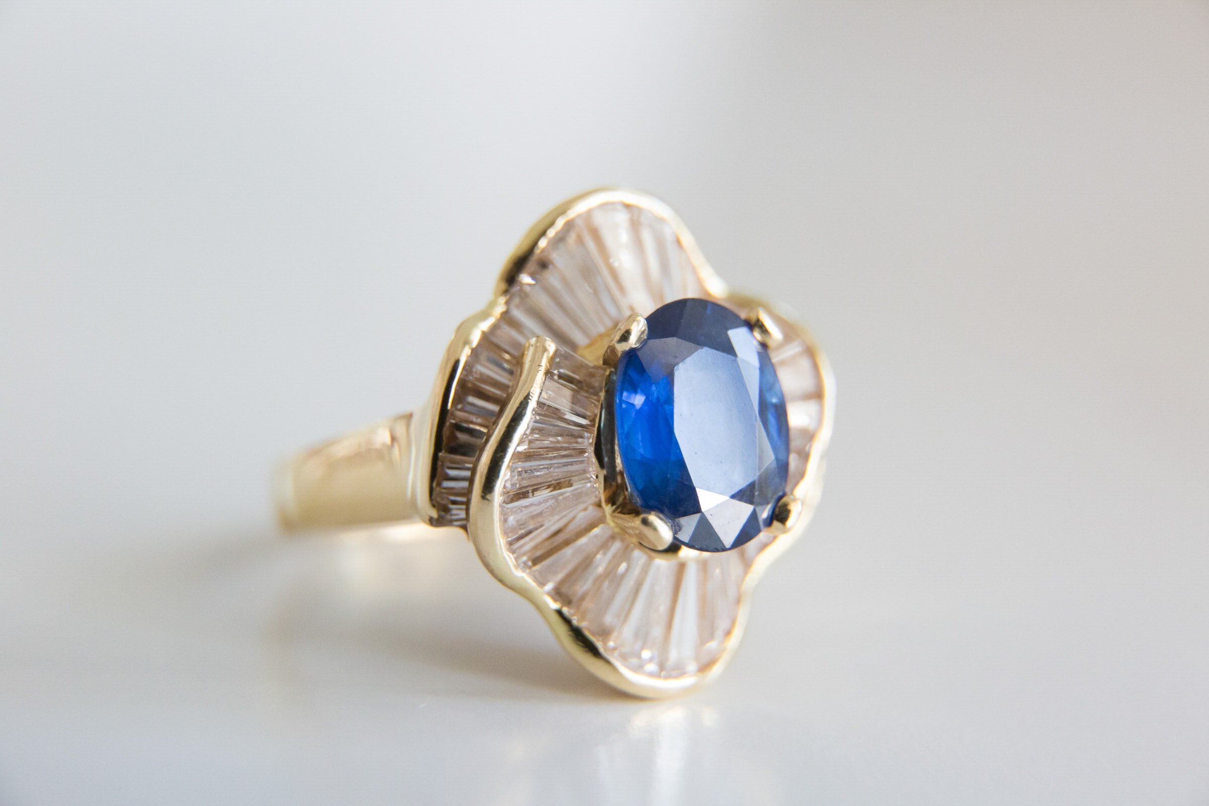 Vintage golden ring with blue gem at the Bradford wedding in New Hill, NC. Best Bradford photographer.