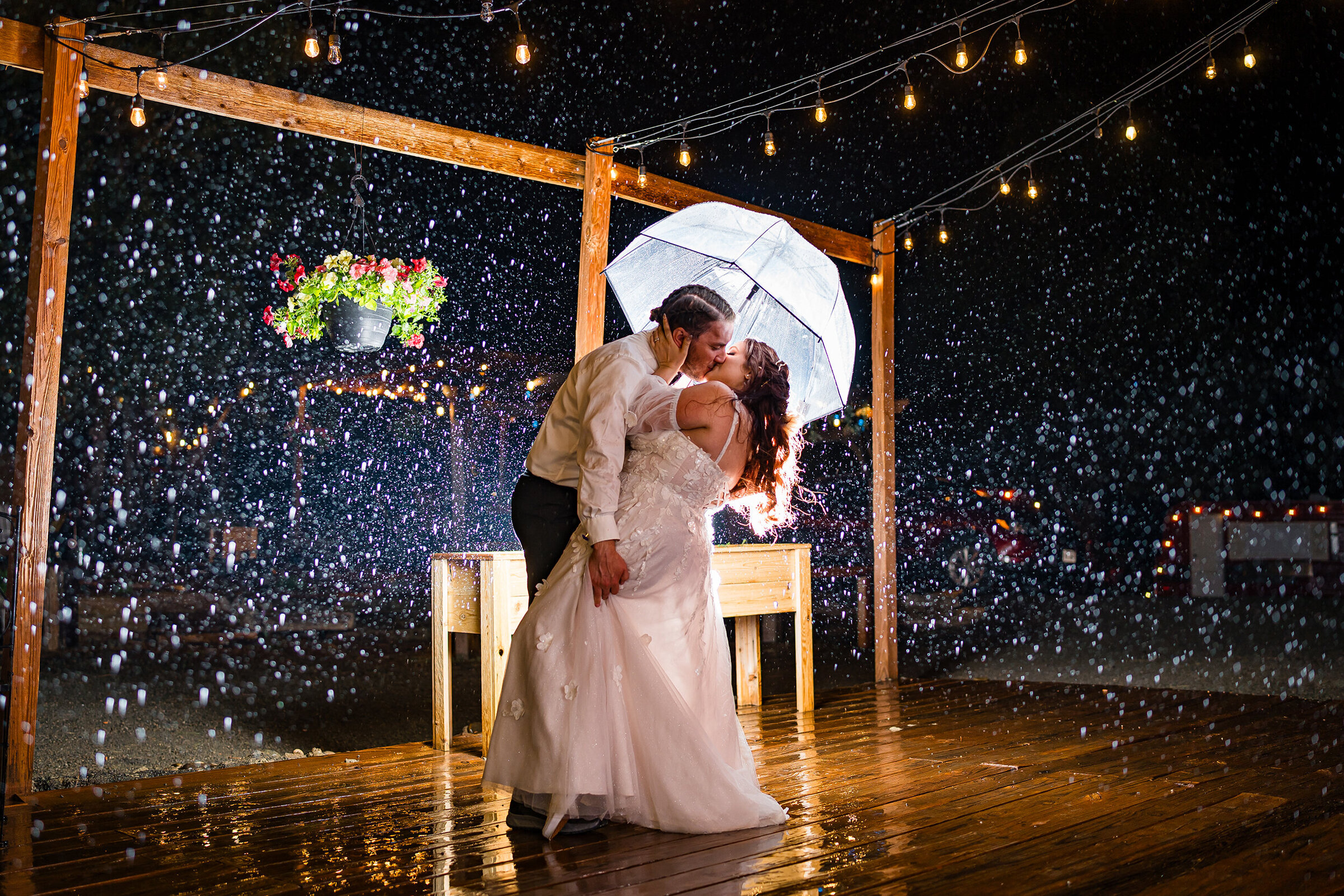 Adventurous Couple walking through a rainstorm while smiling and laughing, epic & fun Colorado Springs Wedding Photography