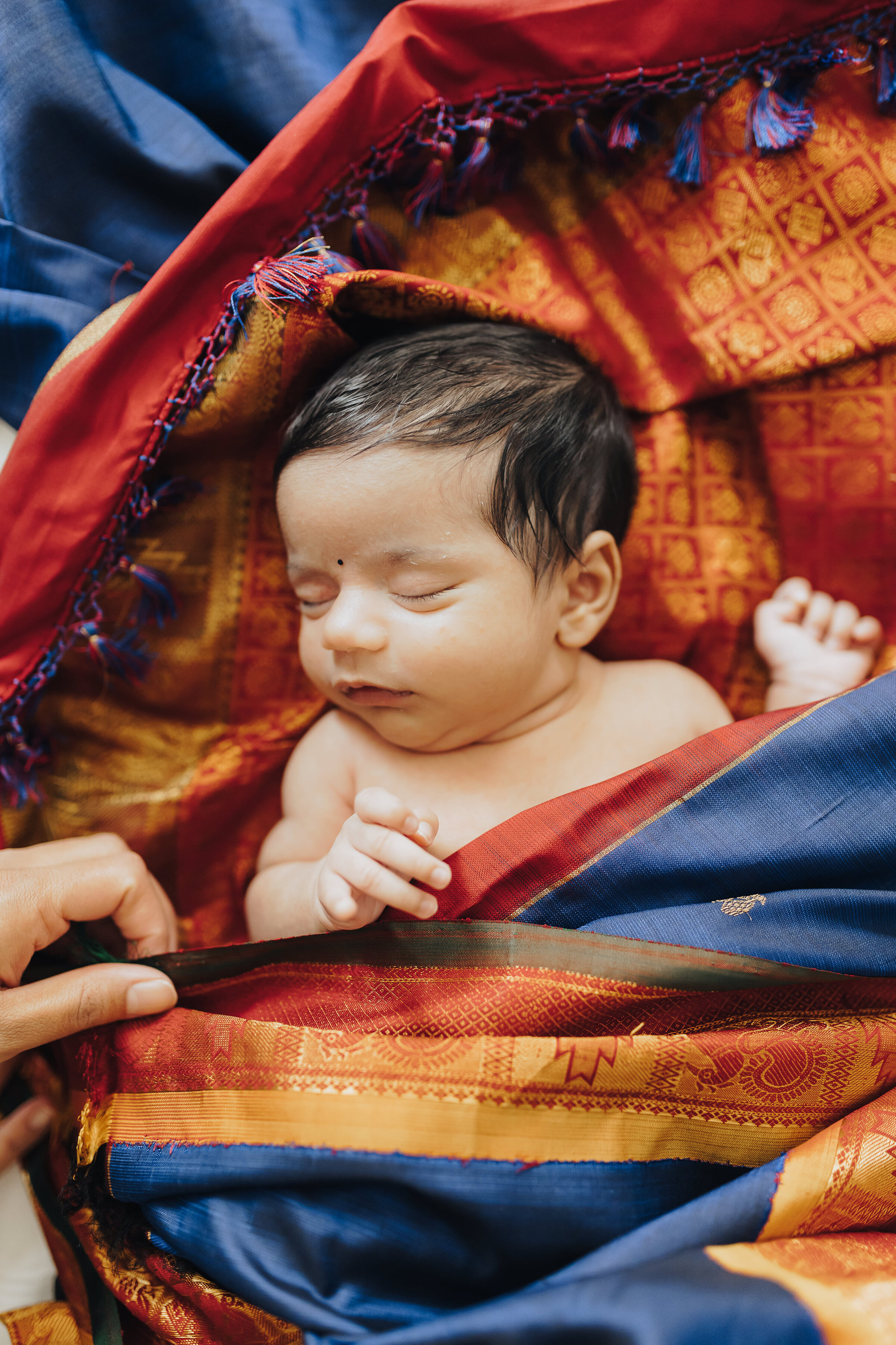 Baby is Swaddled in Colorful Sari
