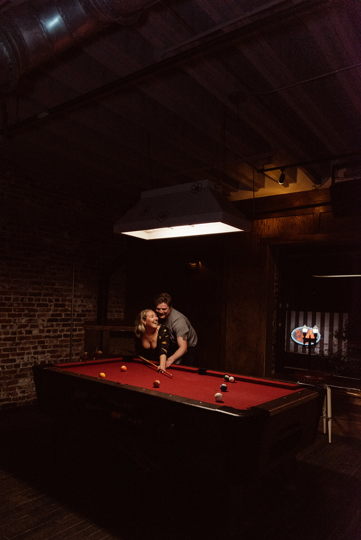 Cinematic Engagement Photos in downtown Hoptinger Bar at night