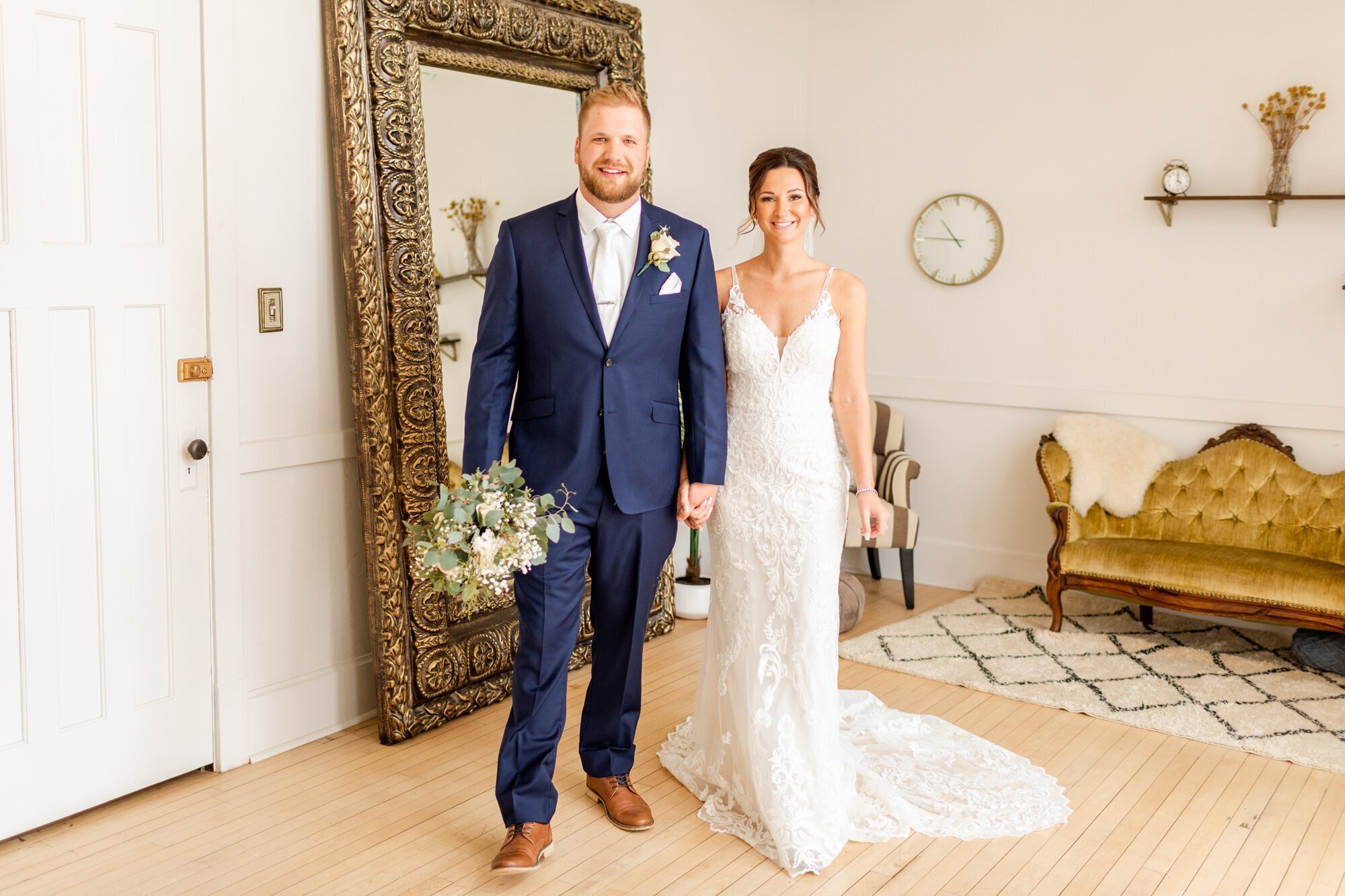 bride and groom holding hands before wedding, taken by minneapolis wedding photographers by Kacey Wyrick Photography