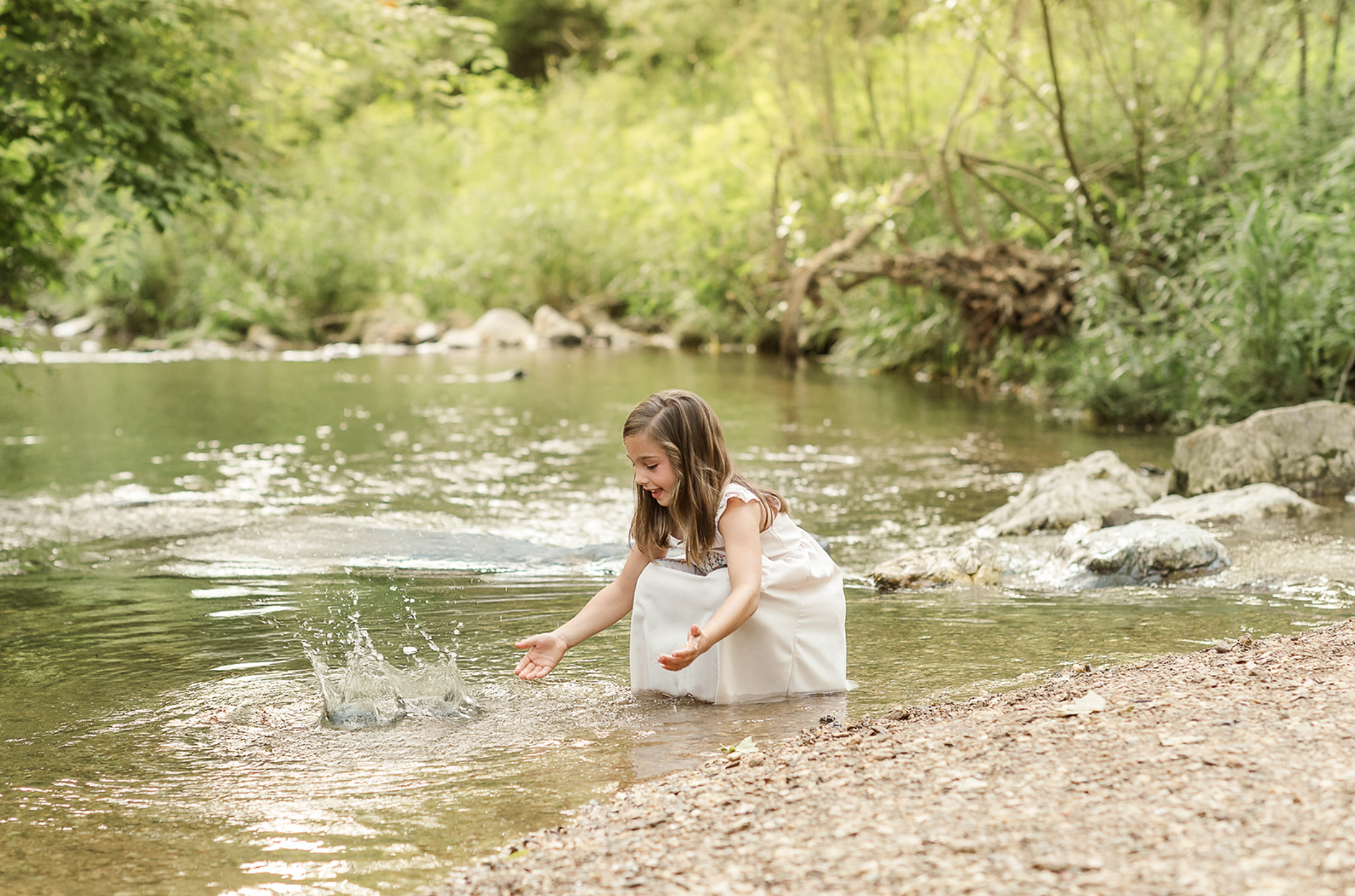 little girl playing by the creek during summer mini session in York, PA