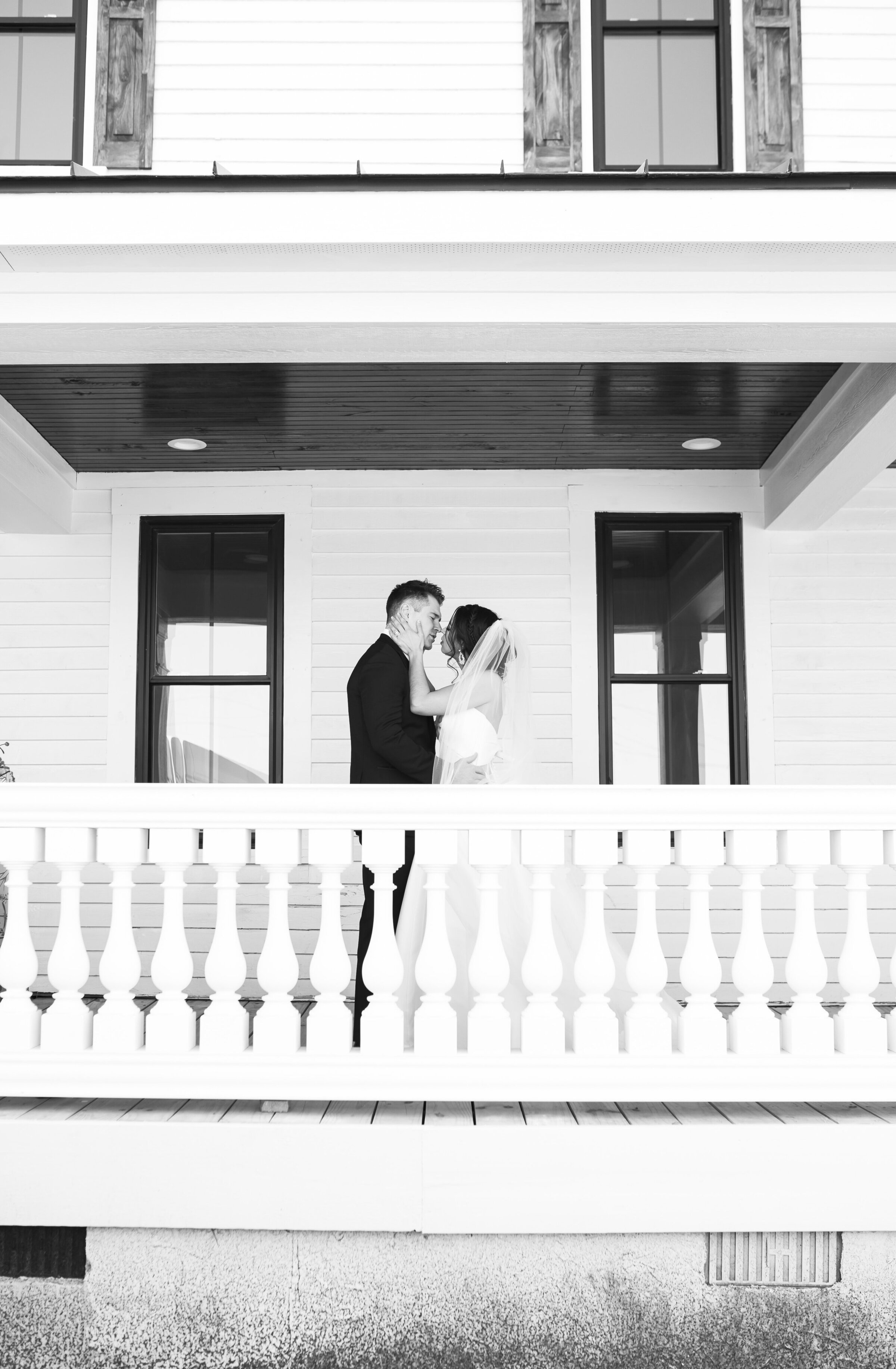 Private moment during a first look at the wrap-around porch of Landon Estate in Clayton, NC. 