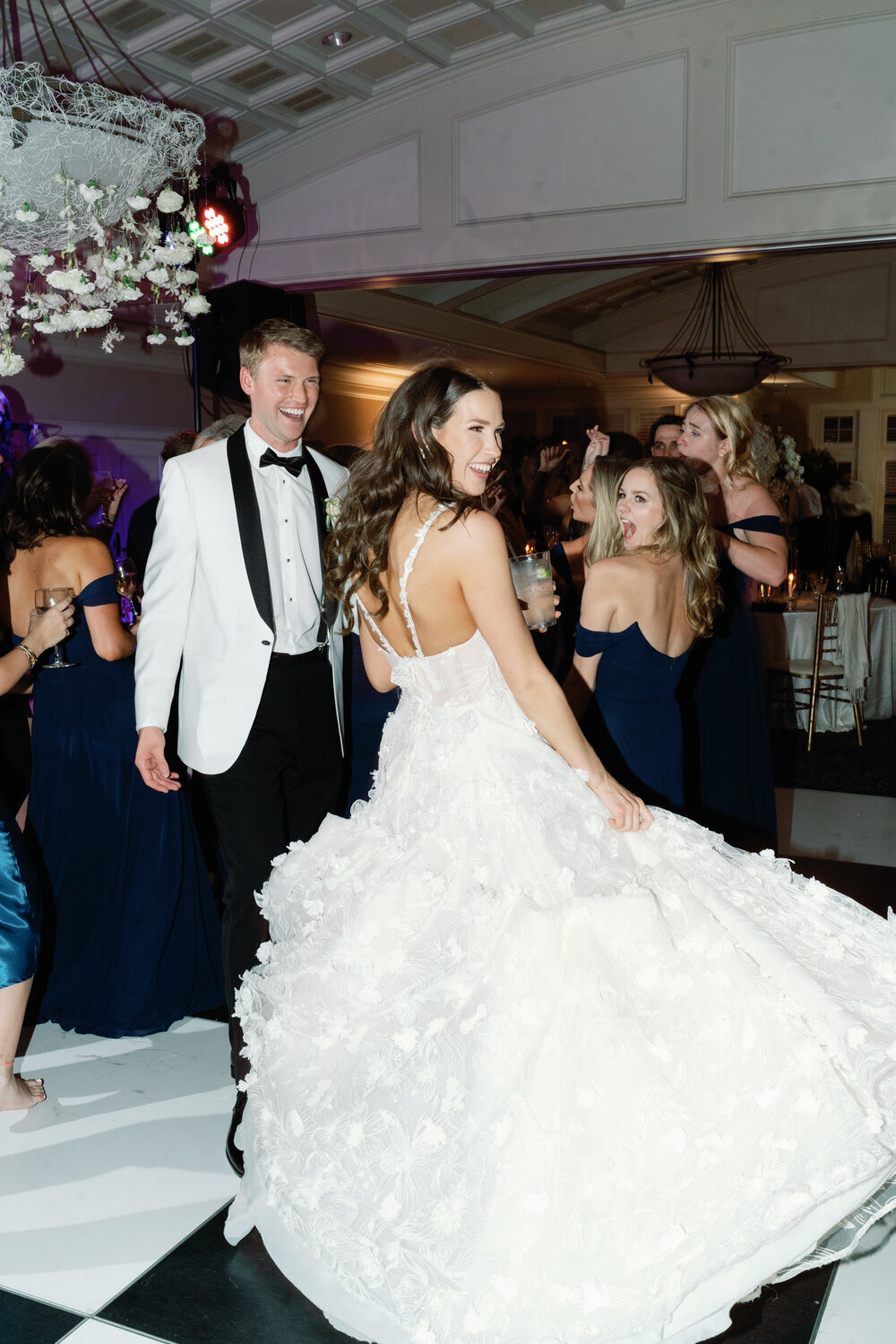 bride spinning in her dress on the dance floor
