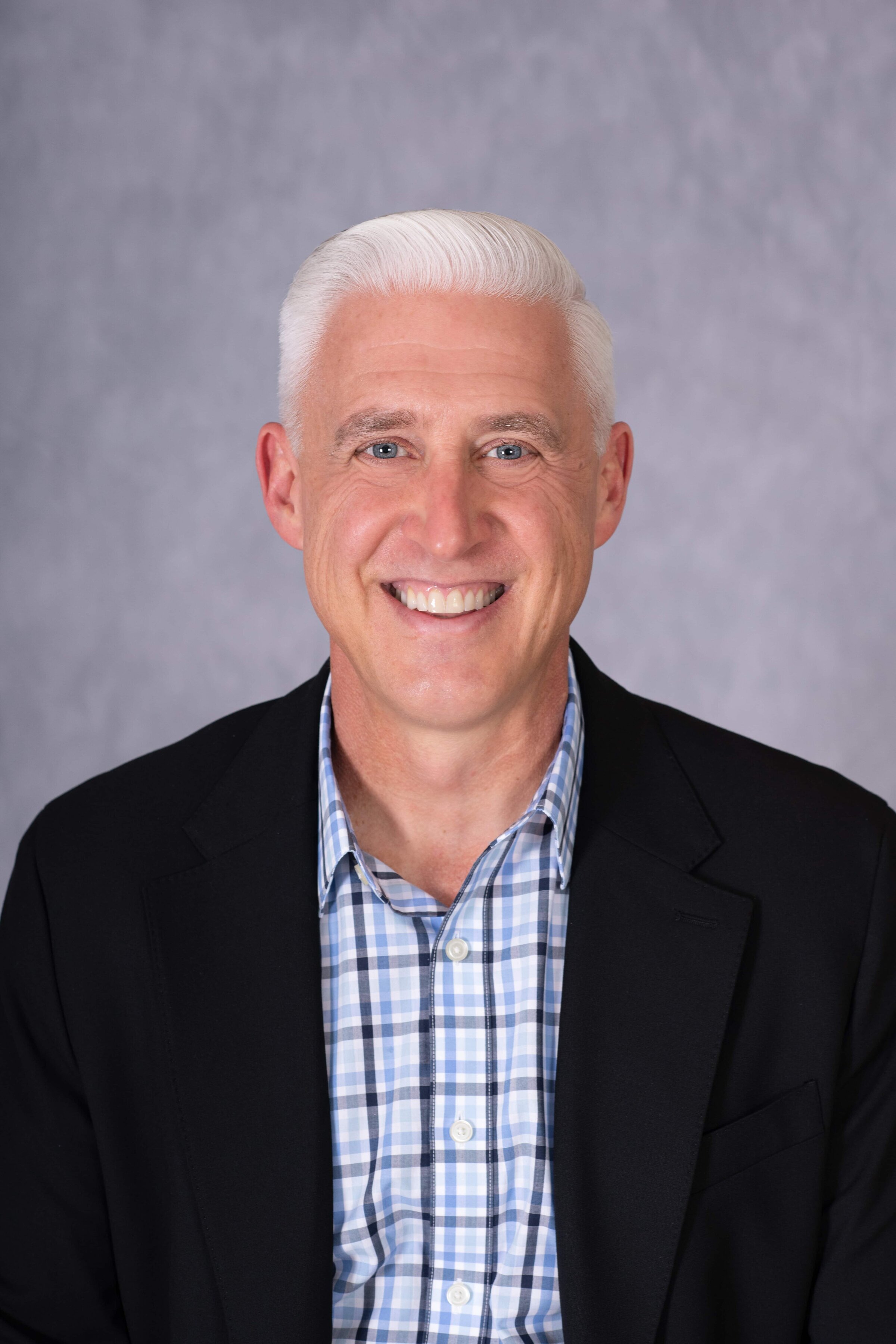 Professional headshot with studio backdrop taken in Virginia for LinkedIn profile