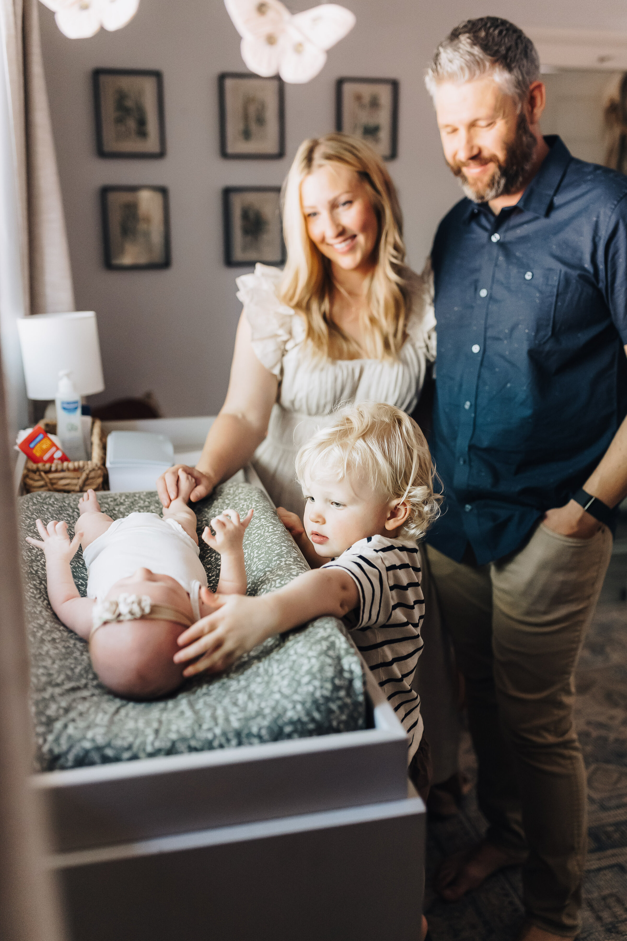 Family Looks at Baby Girl