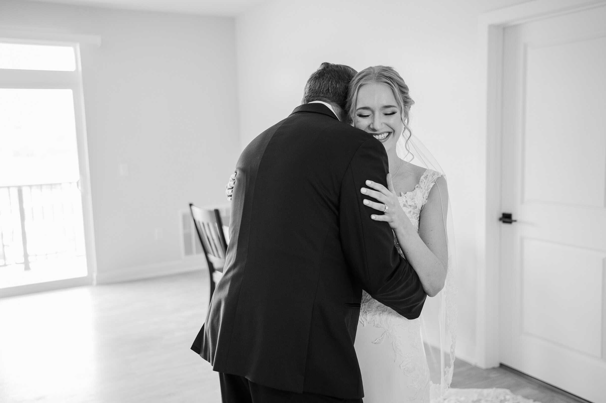 Father and Daughter share an emotional hug during first look