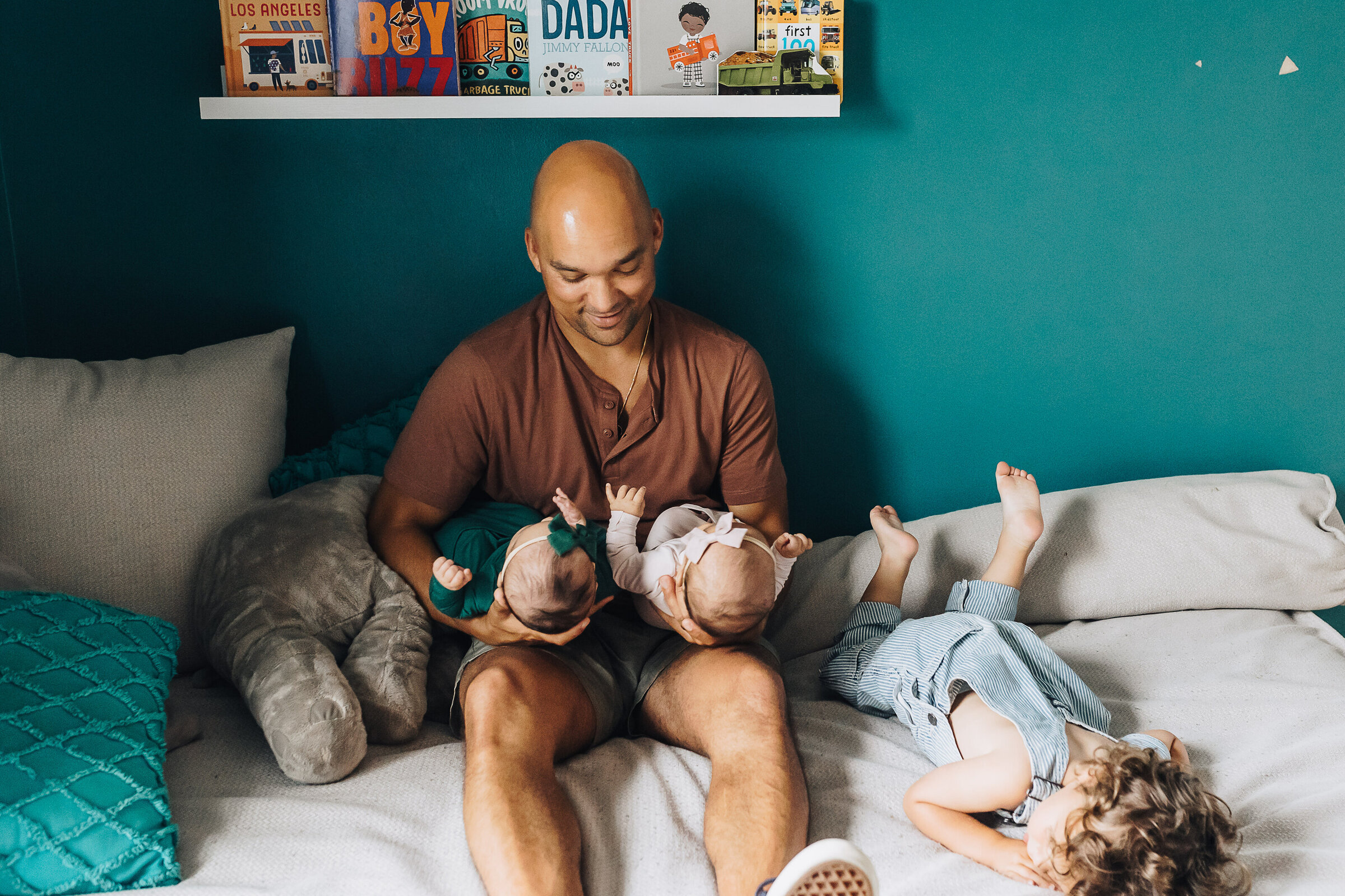 Dad Holds Twin Baby Girls