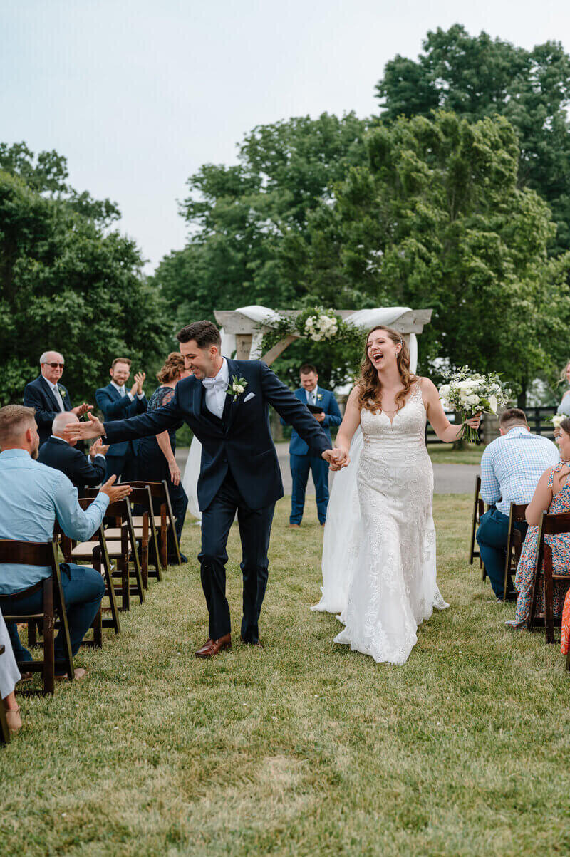 bride and groom walking down the aisle taken by lexington kentucky wedding photographers
