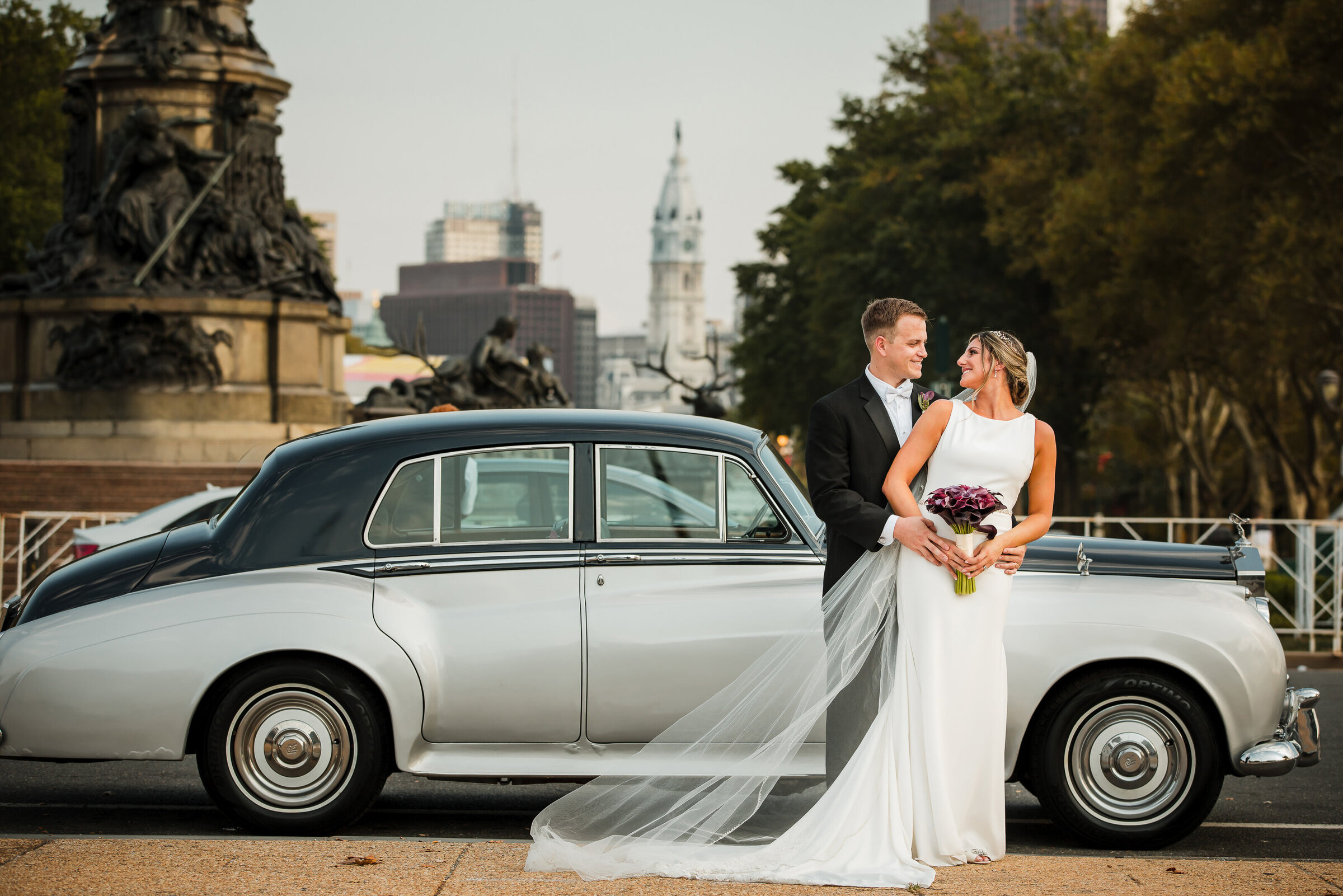 Bride and groom in front of the Rolls Royce at Philadelphia Art Museum