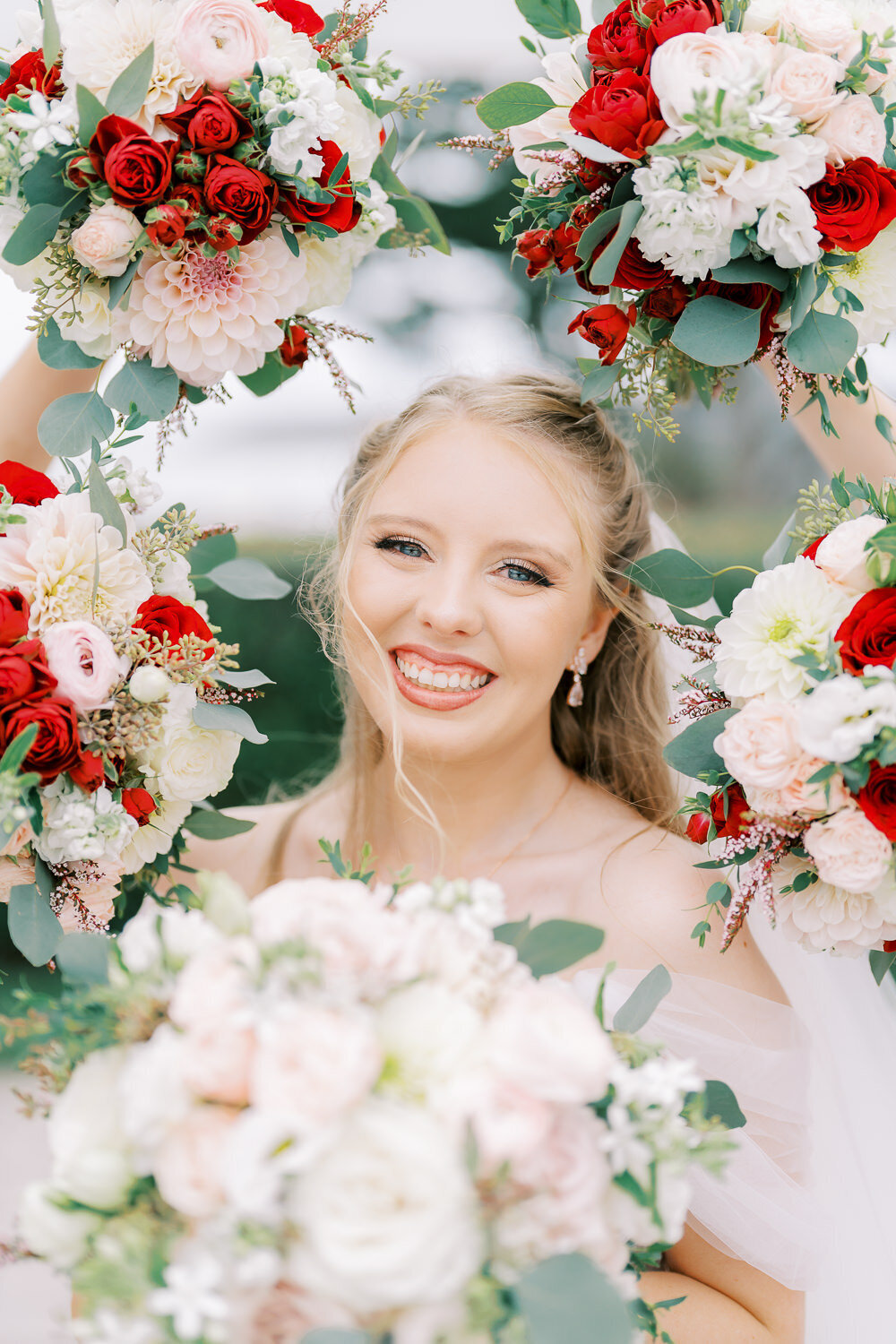 wedding bride surrounded with bridesmaids bouquet