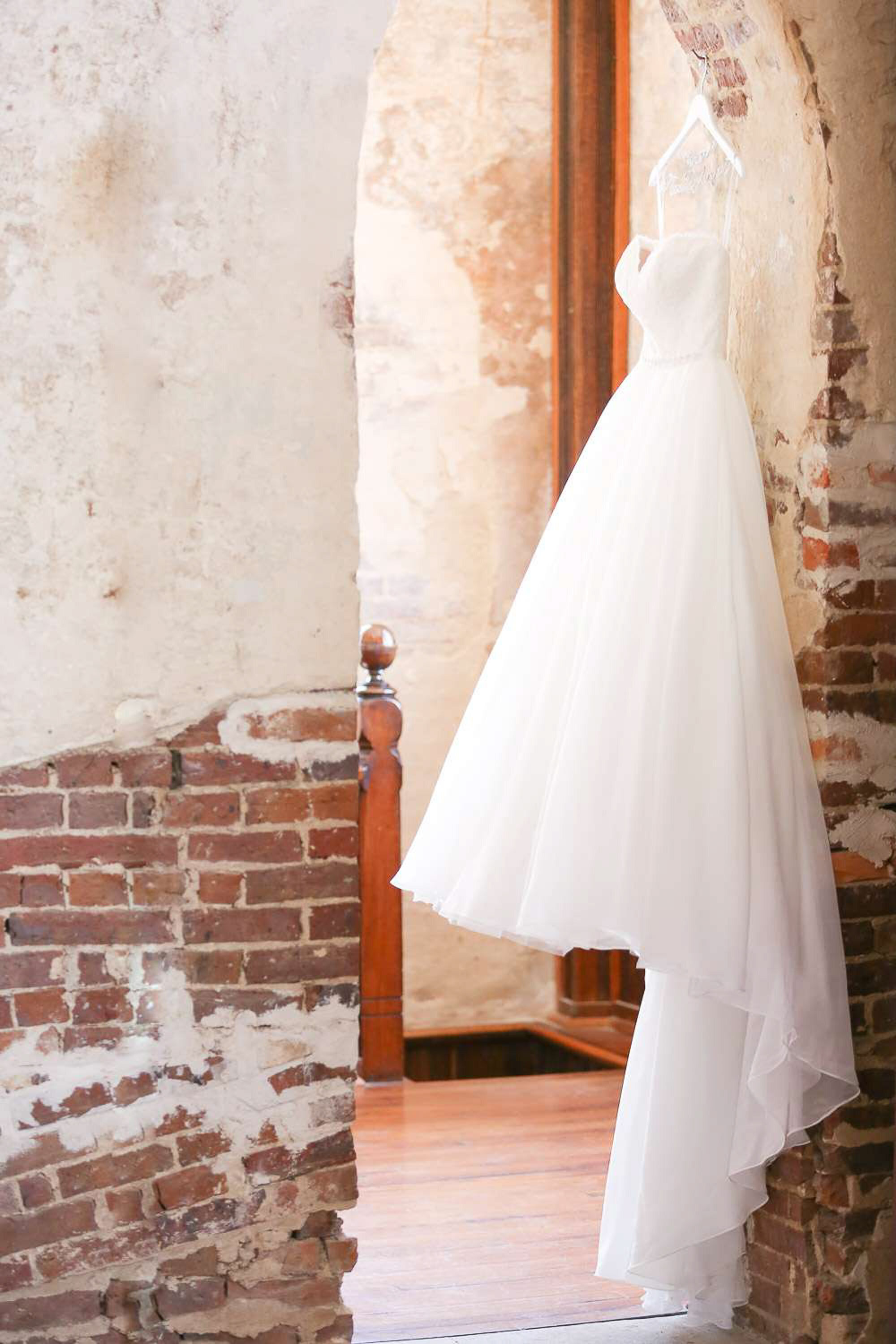 "Wedding dress hanging on the brick wall in the Brooklyn Arts Center in Historic downtown Wilmington, North Carolina"