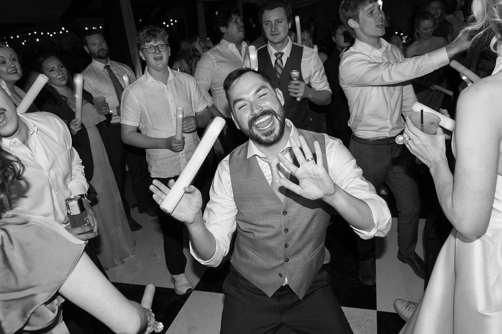 A groom showing off his dance moves.