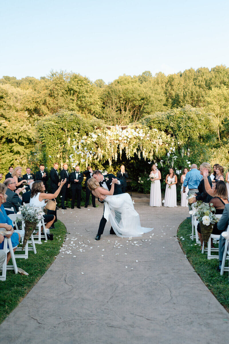 Bride and groom kissing at ceremony in Lexington
